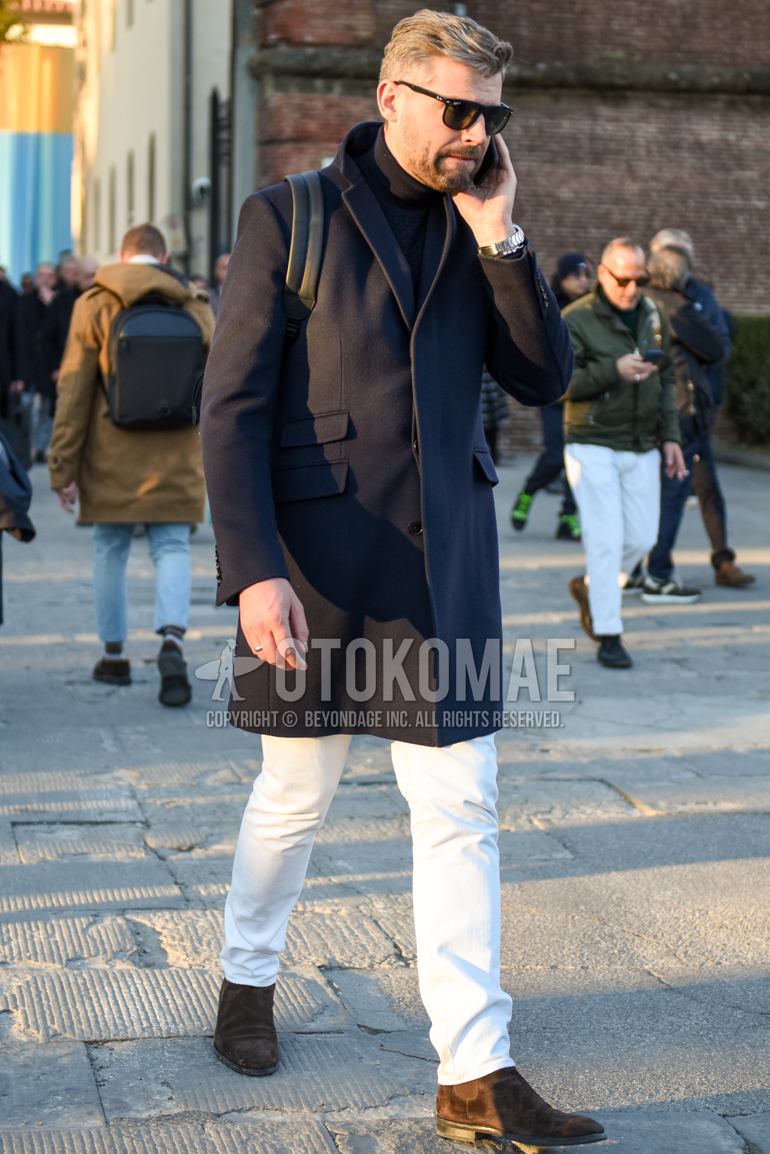 Men's autumn winter outfit with black plain sunglasses, dark gray plain chester coat, black plain turtleneck knit, white plain cotton pants, brown side-gore boots.