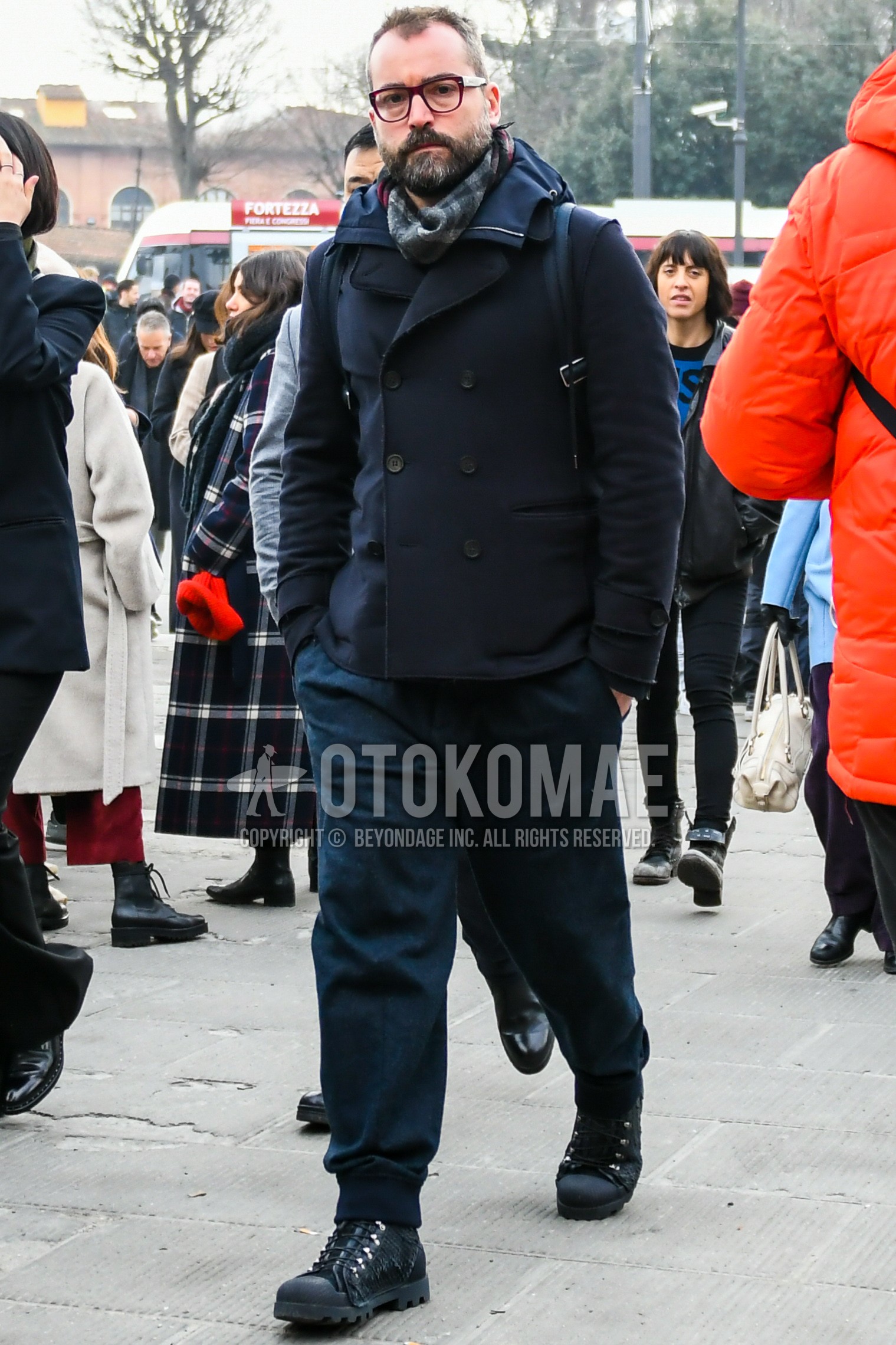 Men's autumn winter outfit with plain glasses, black gray check scarf, black plain p coat, navy plain jogger pants/ribbed pants, black  boots.