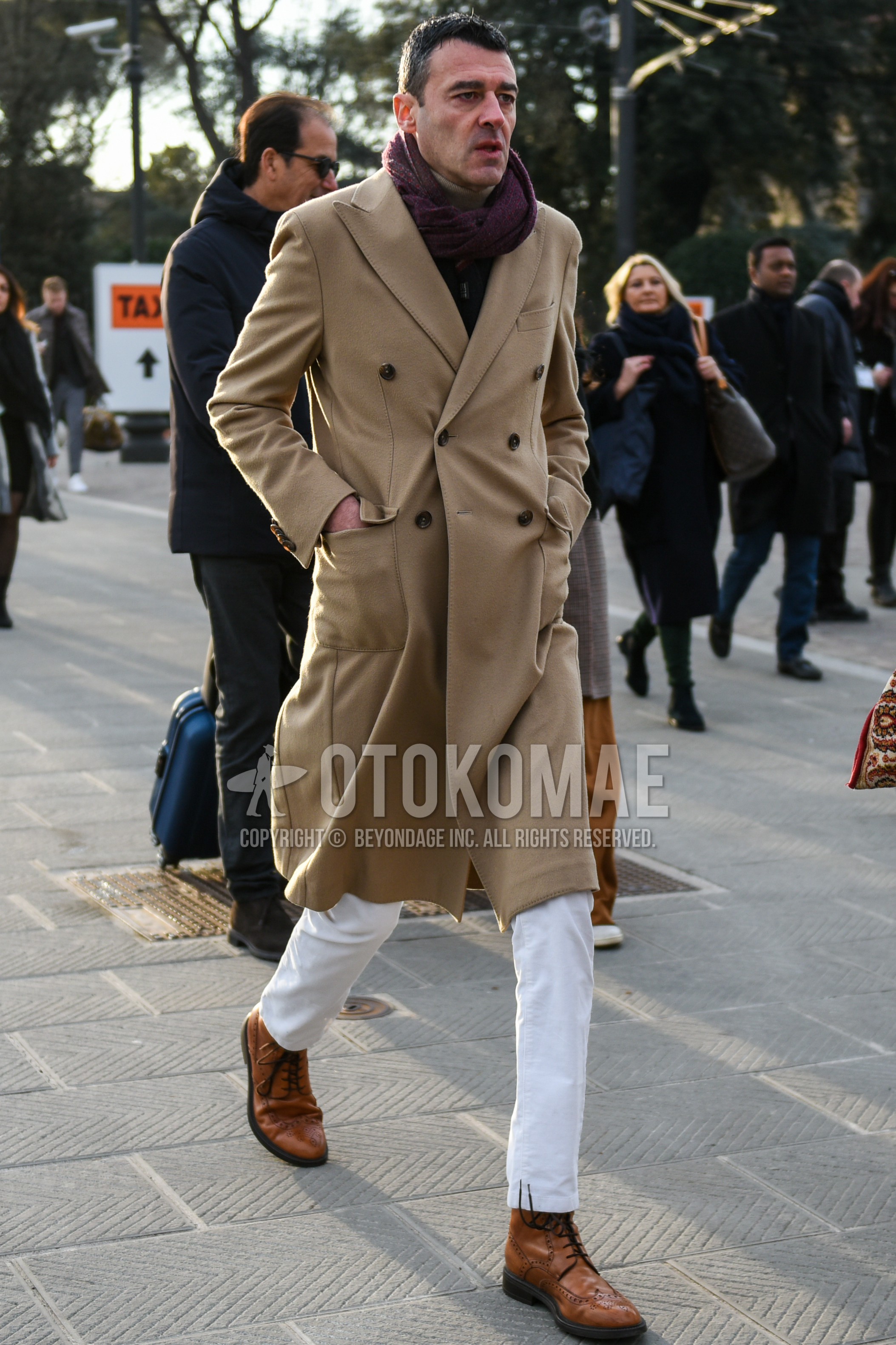 Men's autumn winter outfit with purple plain scarf, beige plain chester coat, white plain cotton pants, brown  boots.