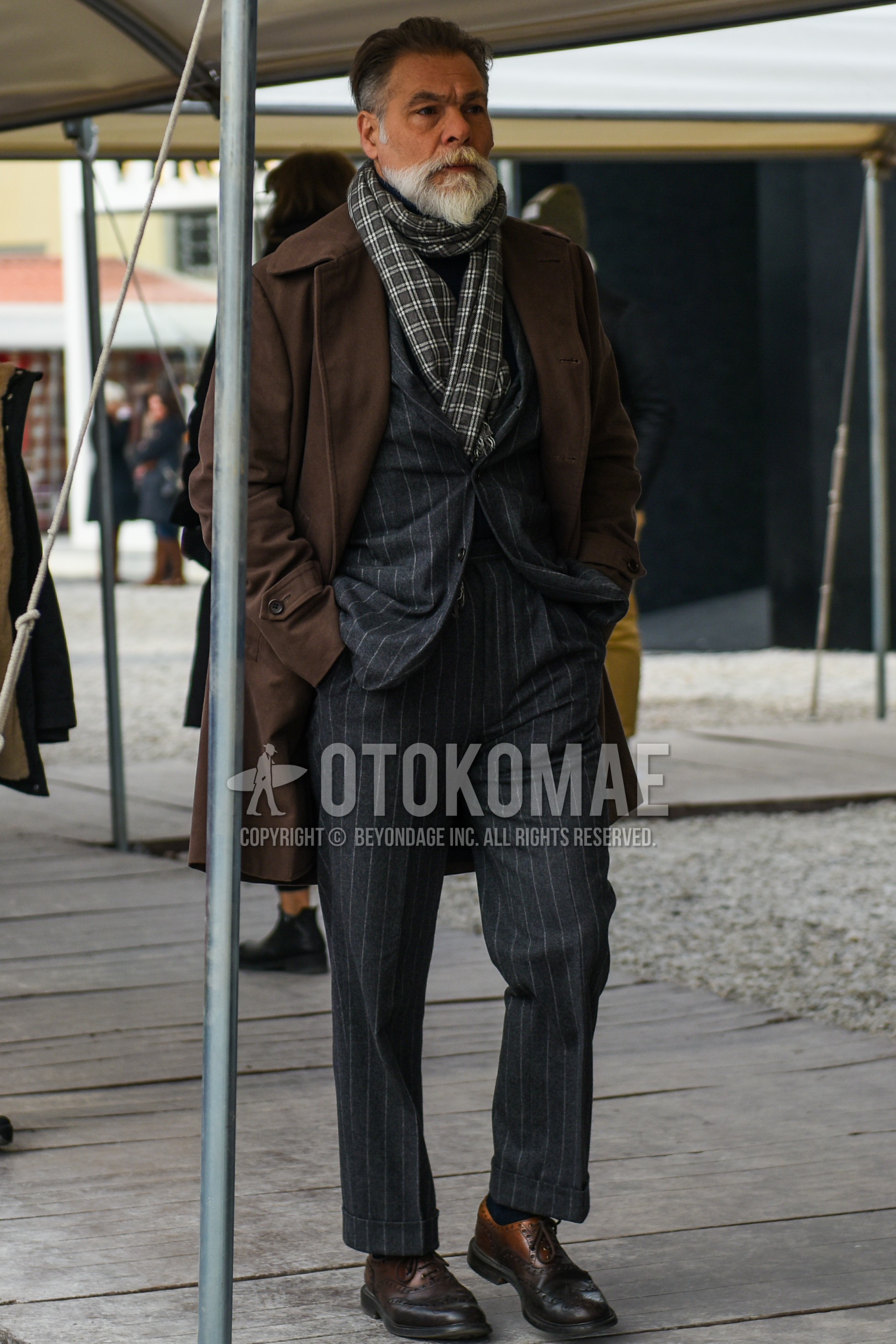 Men's autumn winter outfit with brown white check scarf, brown plain stenkarrer coat, black plain socks, brown wing-tip shoes leather shoes, gray stripes suit.