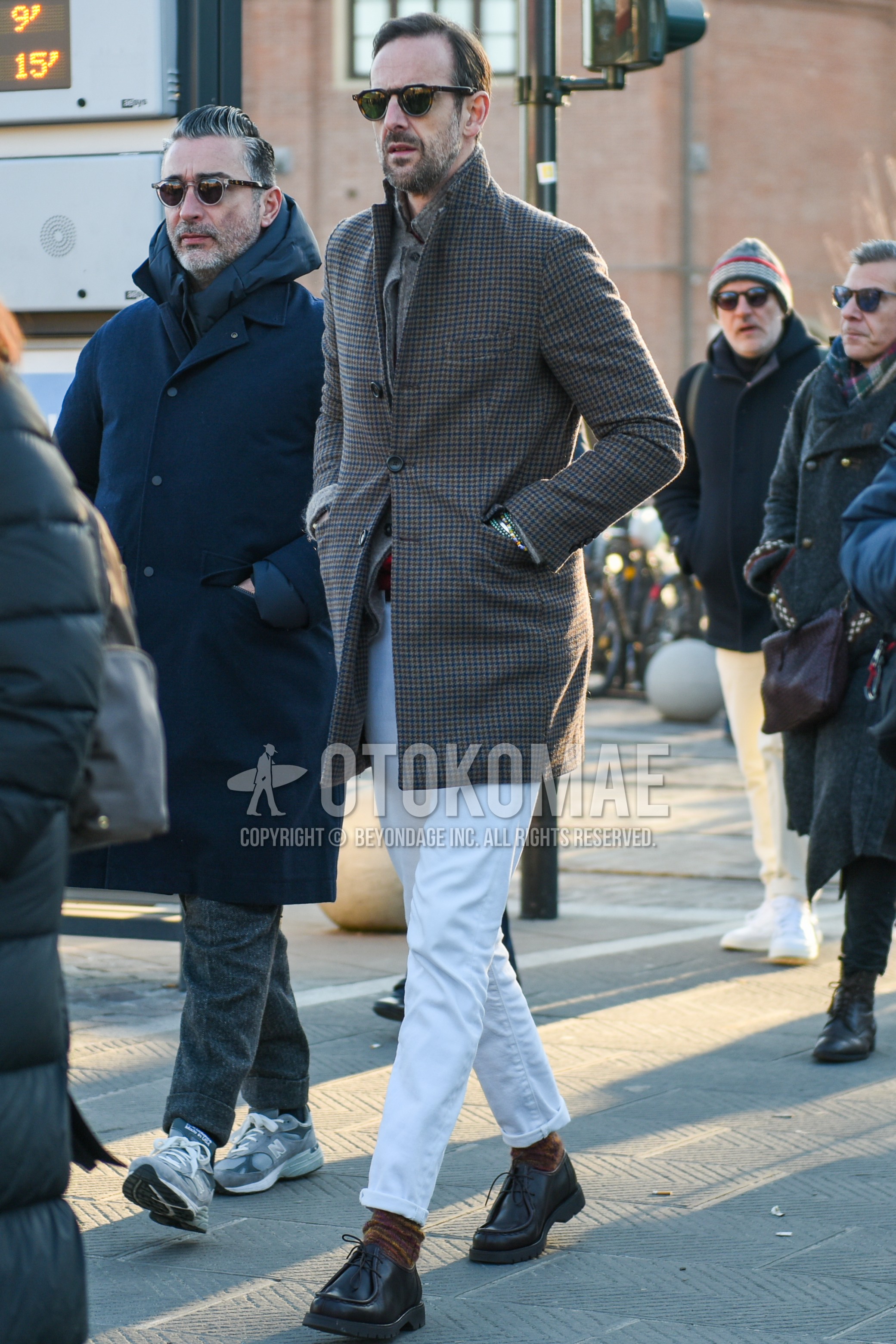 Men's autumn winter outfit with brown tortoiseshell sunglasses, gray check chester coat, gray plain tailored jacket, white plain cotton pants, brown plain socks, black  leather shoes.