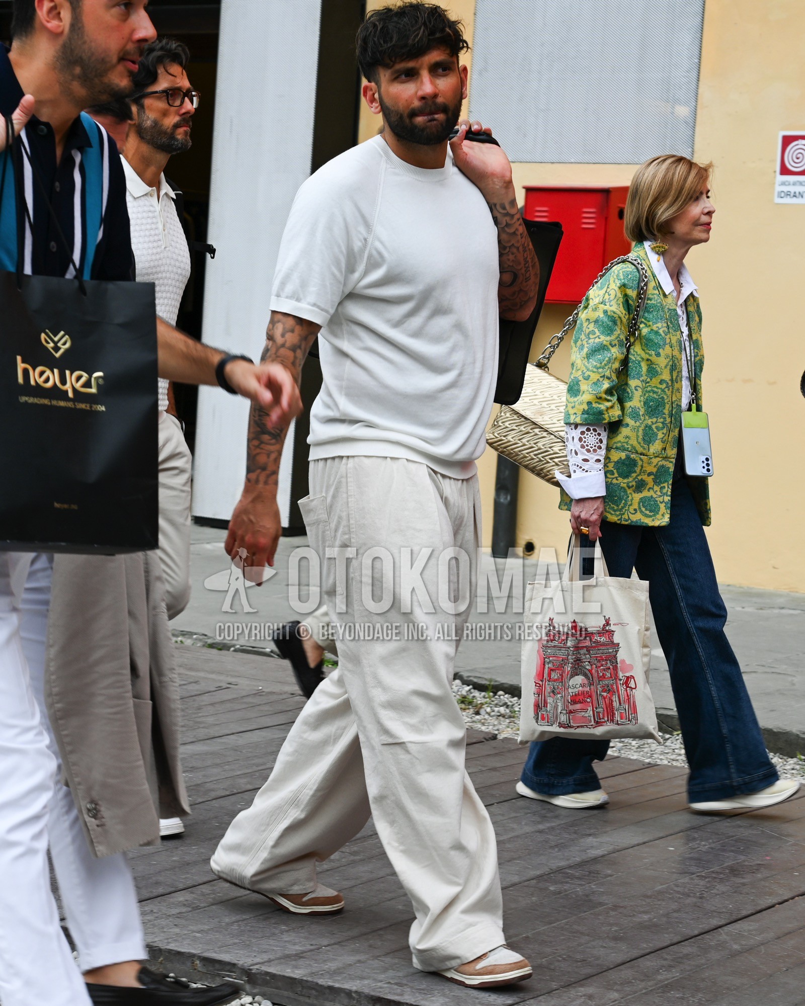 Men's spring summer outfit with white plain t-shirt, white plain wide pants.