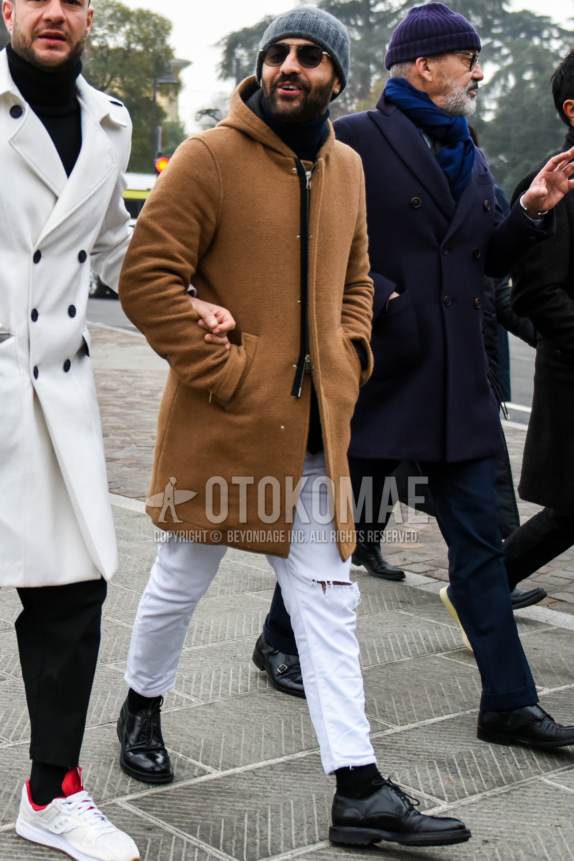 Men's winter outfit with dark gray plain knit cap, plain sunglasses, brown plain hooded coat, white plain damaged jeans, black plain socks, black plain toe leather shoes.