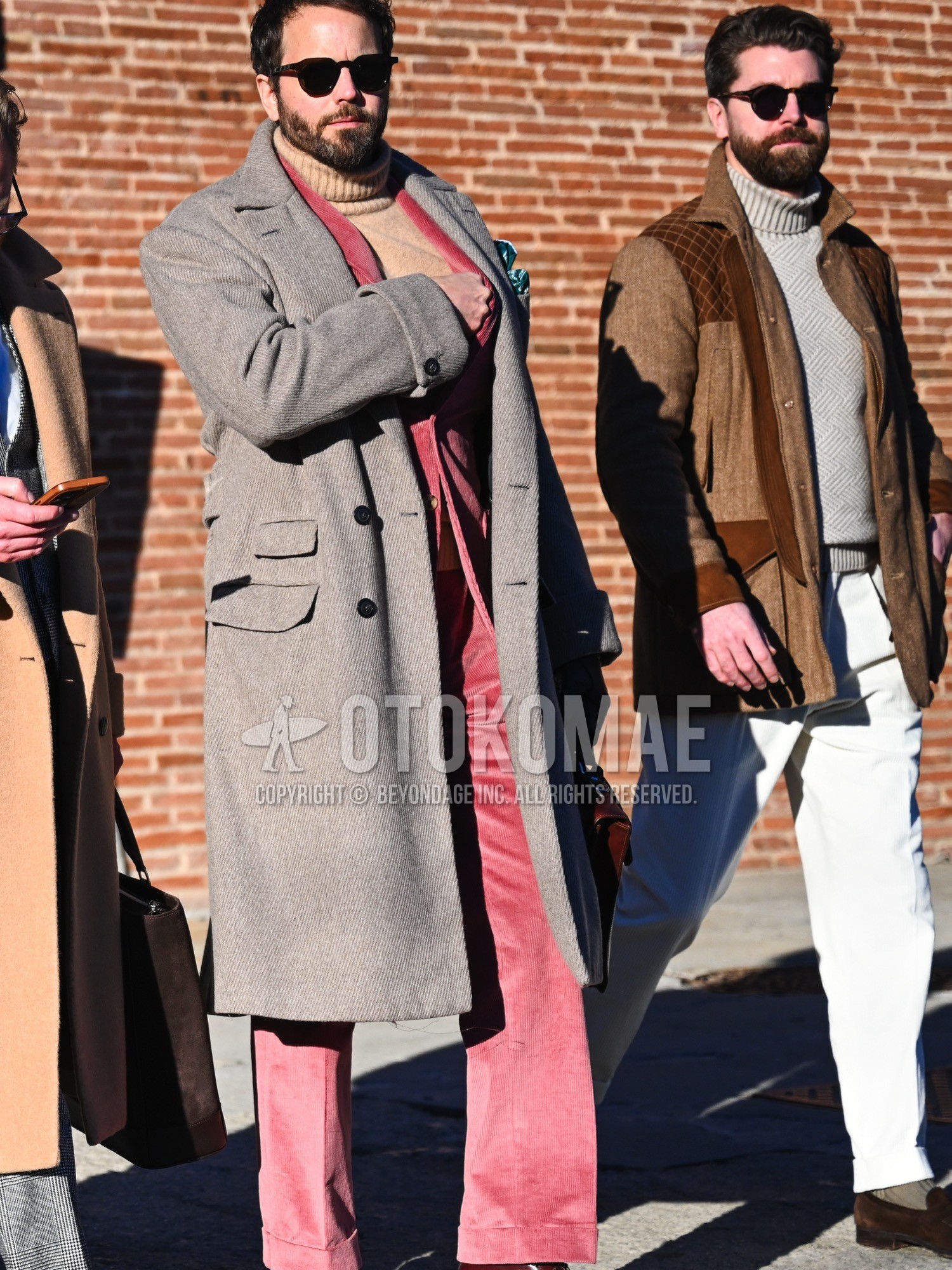 Men's autumn winter outfit with brown plain sunglasses, gray plain ulster coat, beige plain turtleneck knit, pink plain suit.
