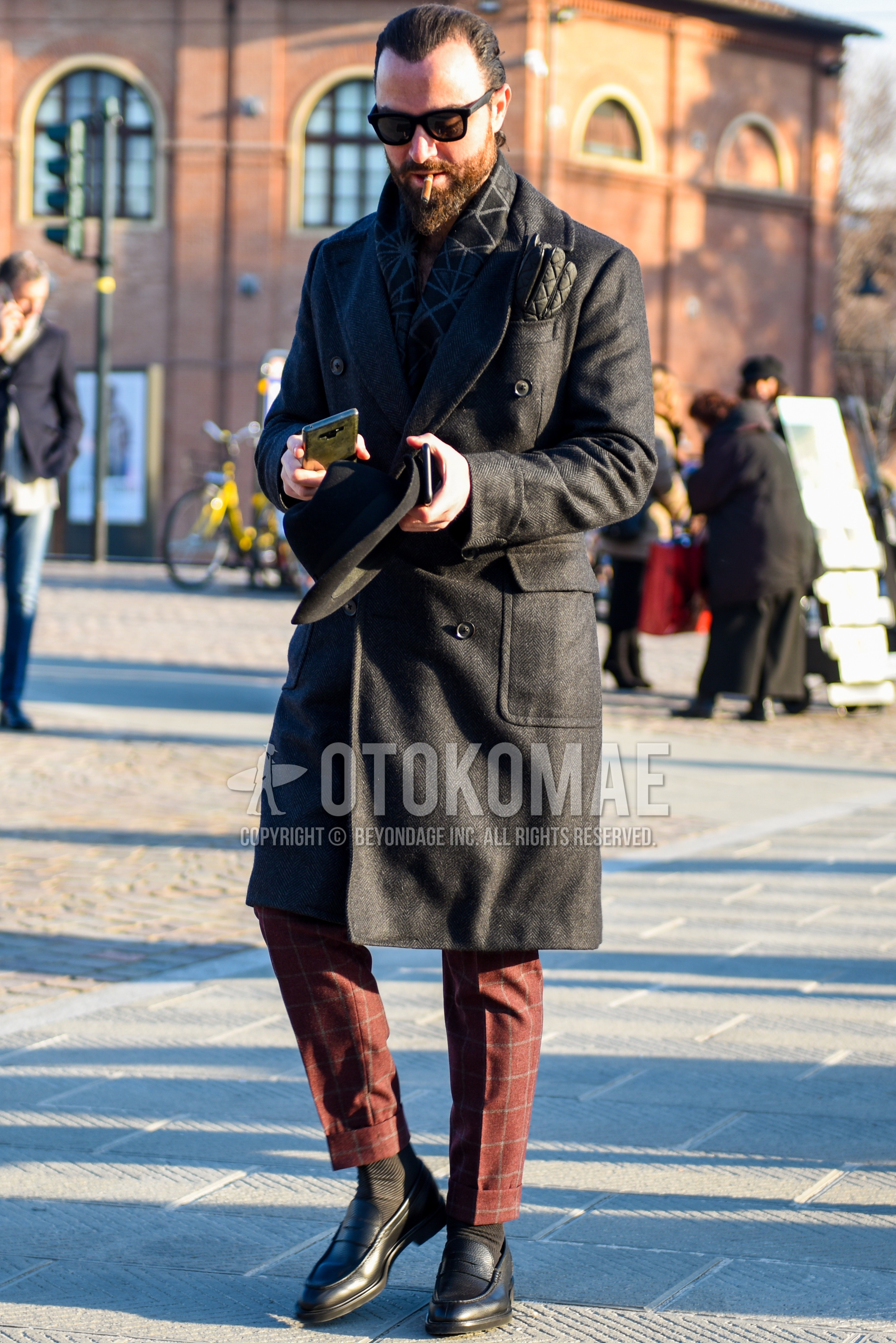 Men's autumn winter outfit with black plain sunglasses, dark gray scarf scarf, black plain chester coat, red check slacks, dark gray plain socks, black coin loafers leather shoes.