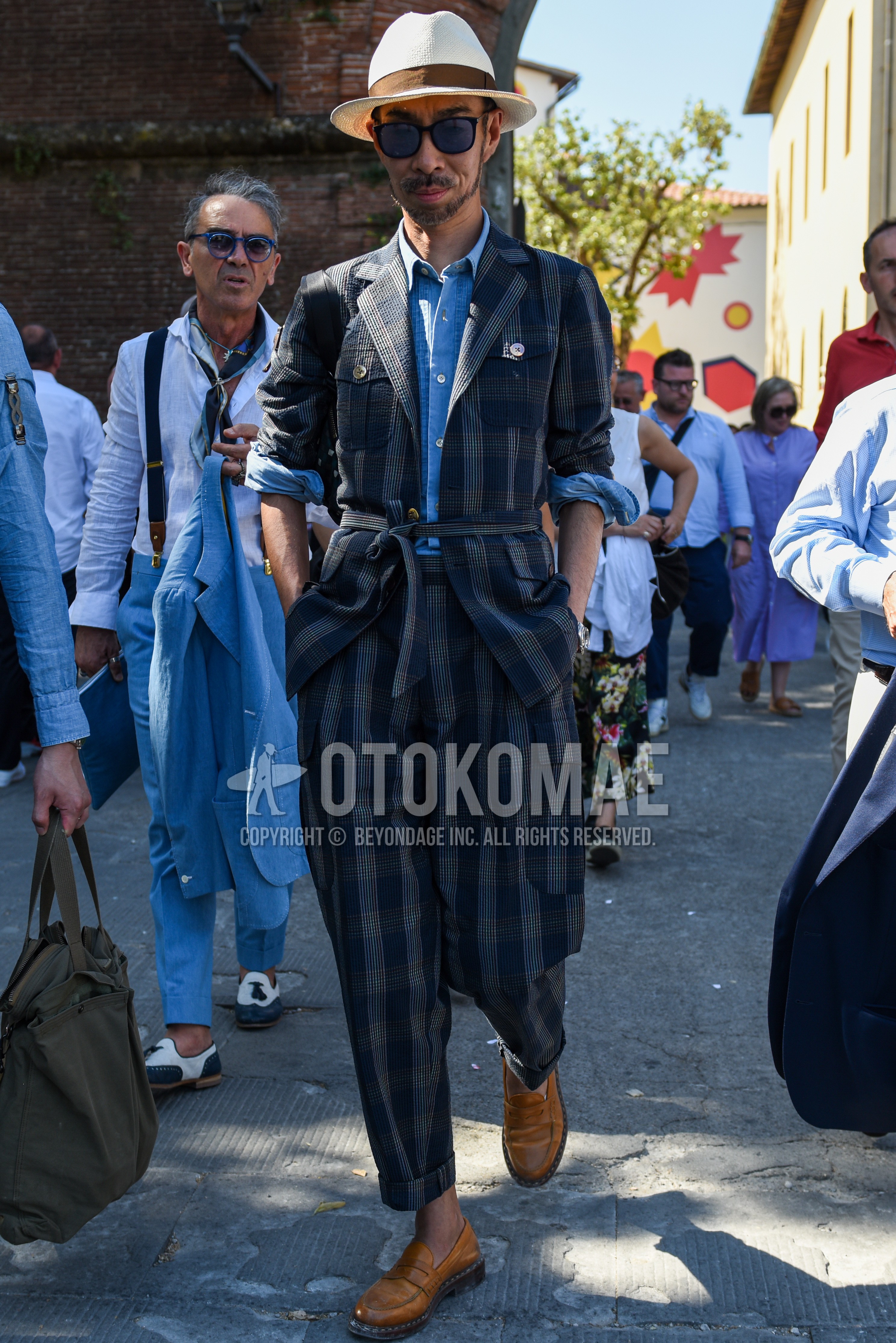 Men's spring summer autumn outfit with white plain hat, black plain sunglasses, light blue plain shirt, brown coin loafers leather shoes, navy dark gray check suit.