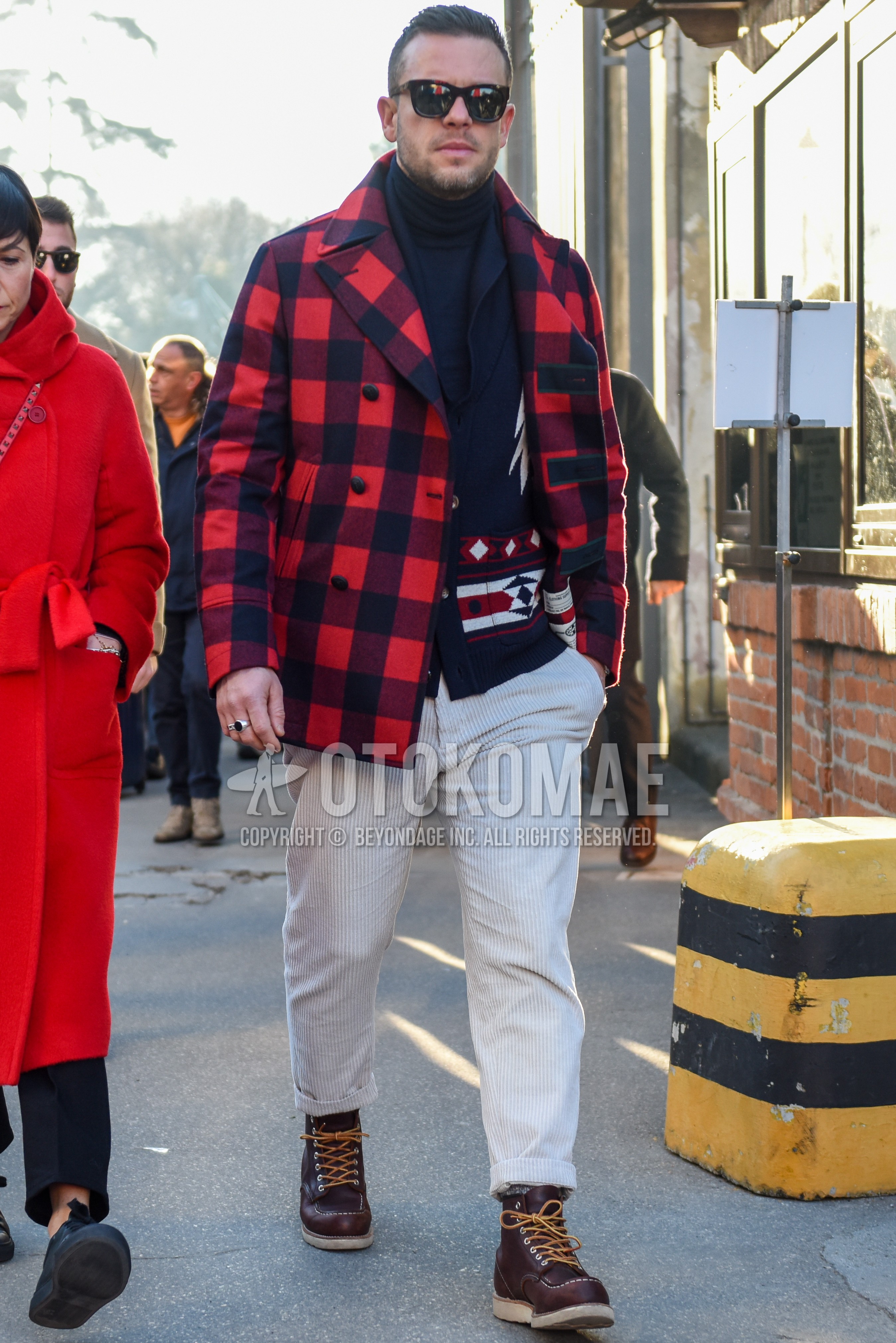Men's autumn winter outfit with brown tortoiseshell sunglasses, red black check p coat, navy plain turtleneck knit, navy tops/innerwear cardigan, white plain winter pants (corduroy,velour), brown work boots.