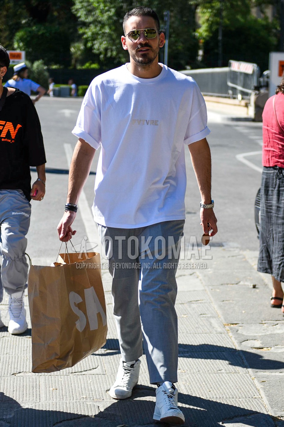 Men's summer outfit with white one point t-shirt, gray plain slacks, white high-cut sneakers.