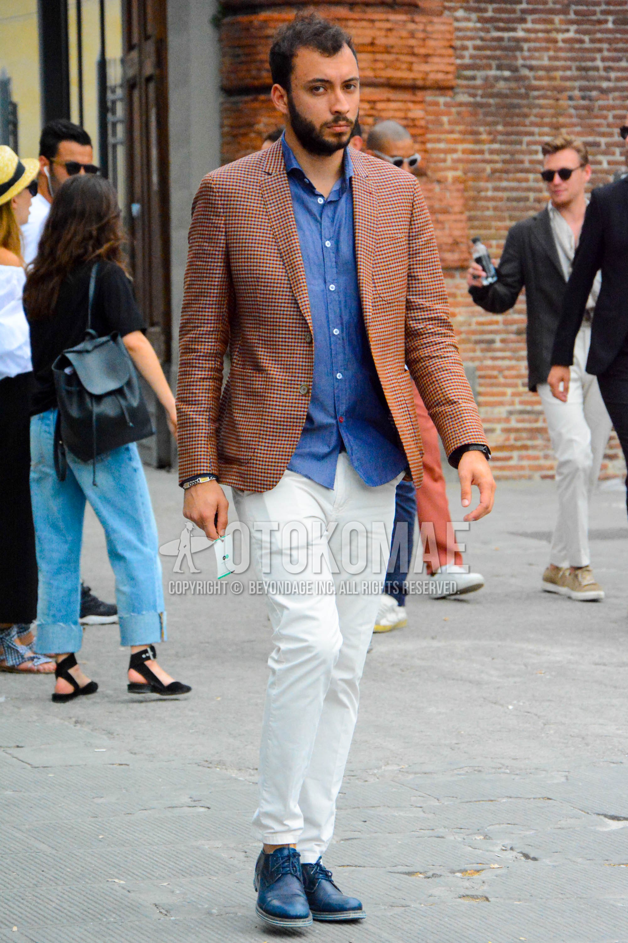 Men's spring summer autumn outfit with brown check tailored jacket, blue plain shirt, white plain cotton pants, navy straight-tip shoes leather shoes.