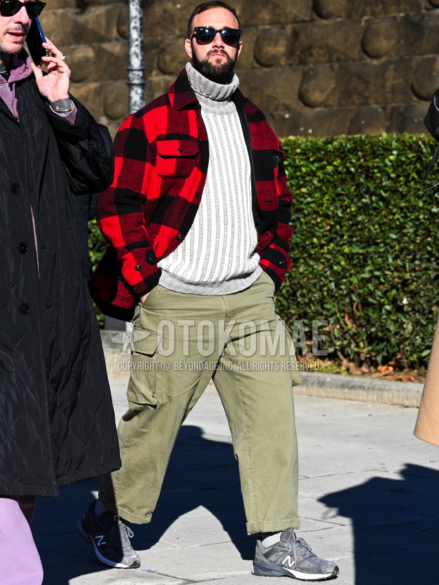 Men's autumn winter outfit with black plain sunglasses, red black check coverall, gray stripes turtleneck knit, olive green plain cargo pants, olive green plain winter pants (corduroy,velour), white plain socks, gray low-cut sneakers.