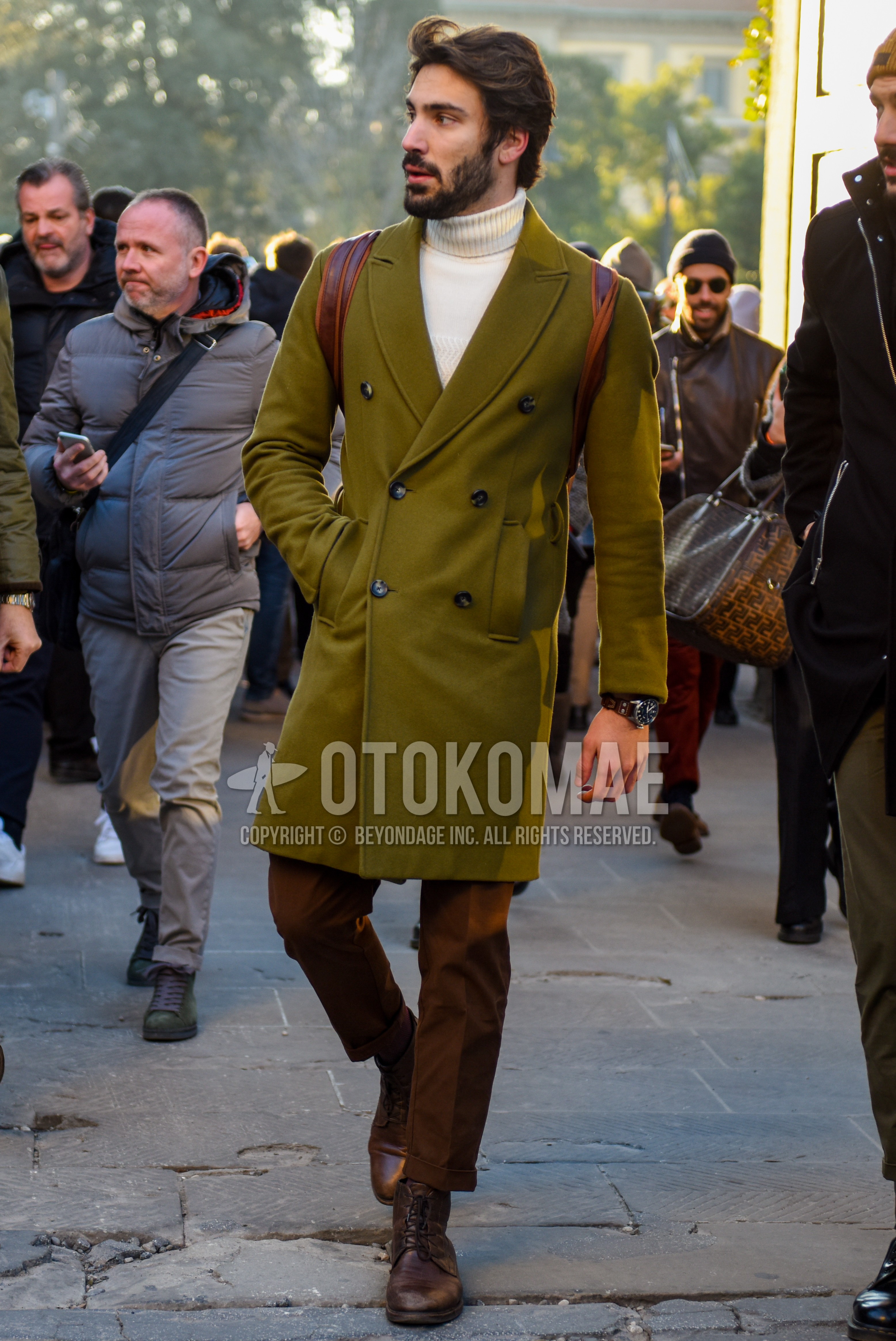 Men's autumn winter outfit with olive green plain chester coat, white plain turtleneck knit, brown plain slacks, brown  boots.