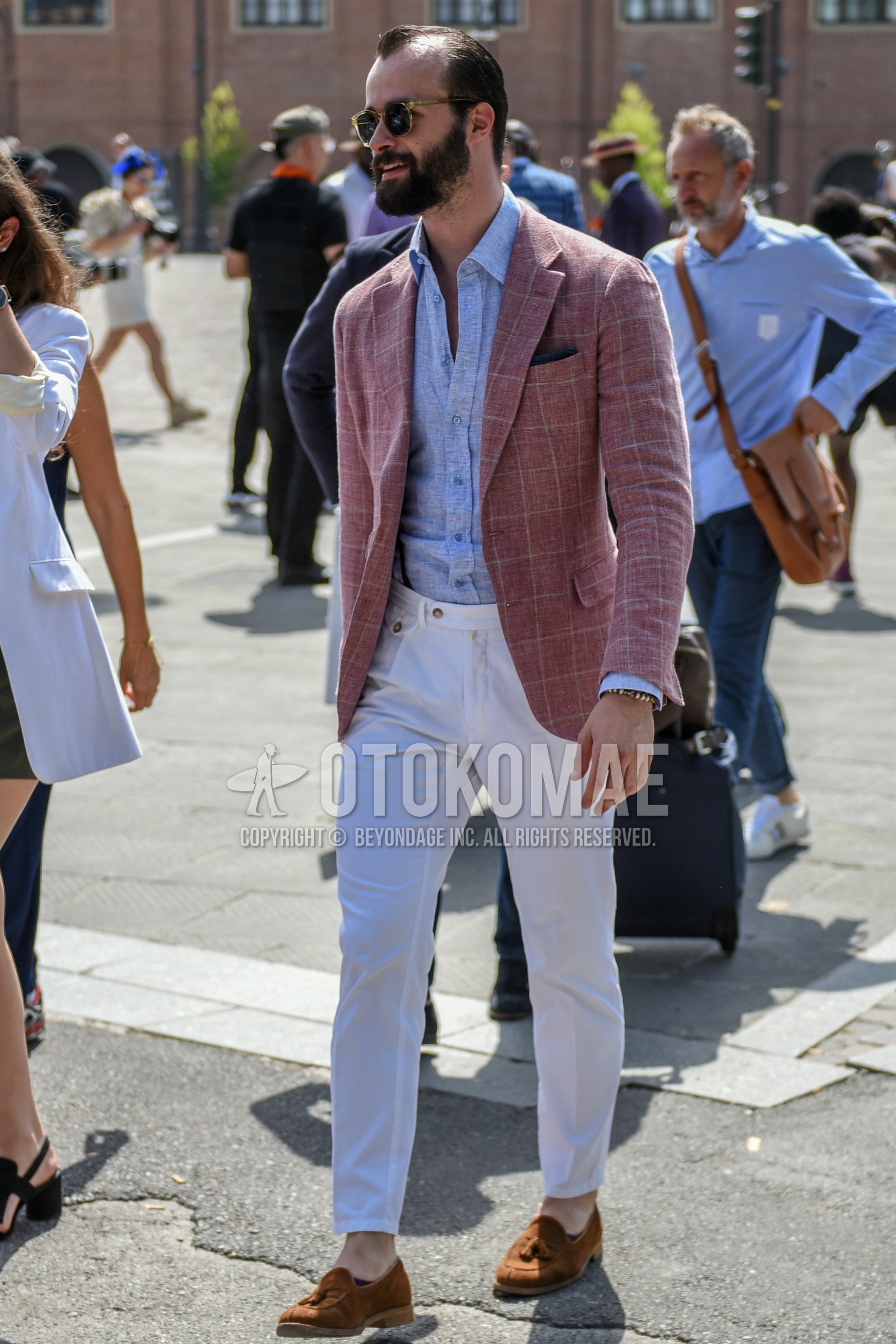 Men's spring summer outfit with brown tortoiseshell sunglasses, red check tailored jacket, light blue plain shirt, white plain cotton pants, brown tassel loafers leather shoes.