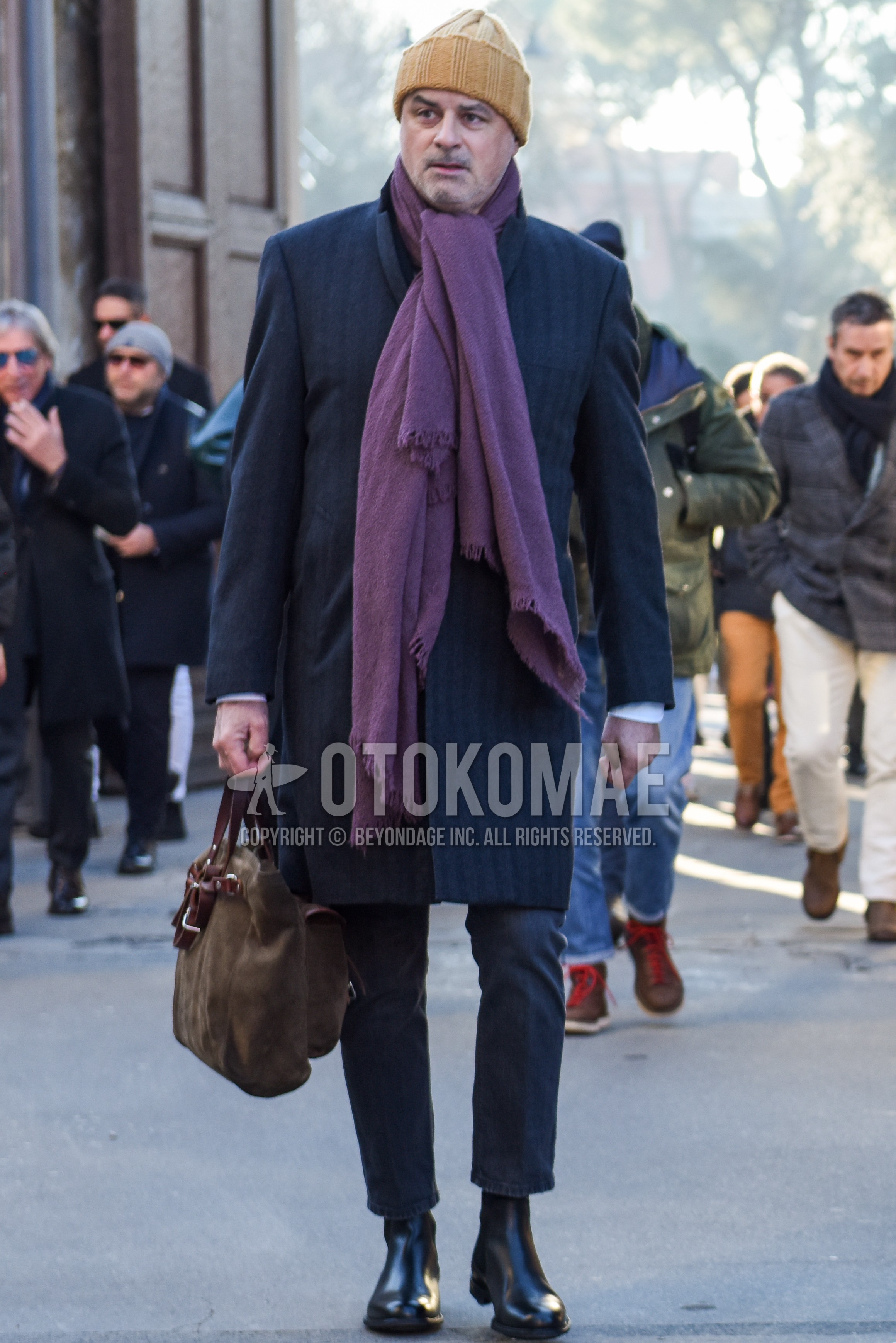Men's autumn winter outfit with purple plain scarf, gray stripes chester coat, gray plain denim/jeans, gray plain cropped pants, black side-gore boots, beige plain briefcase/handbag.