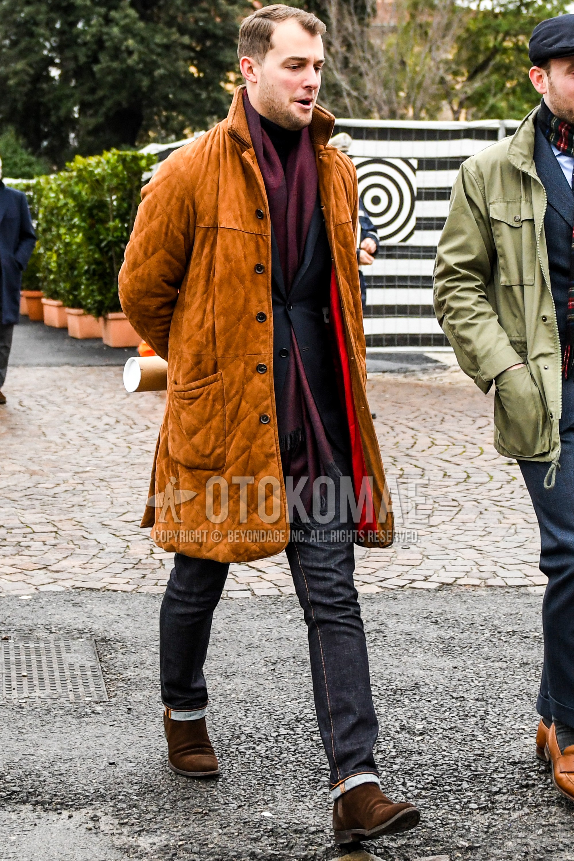 Men's autumn winter outfit with red plain scarf, beige plain stenkarrer coat, black plain tailored jacket, black plain denim/jeans, brown side-gore boots, suede shoes leather shoes.