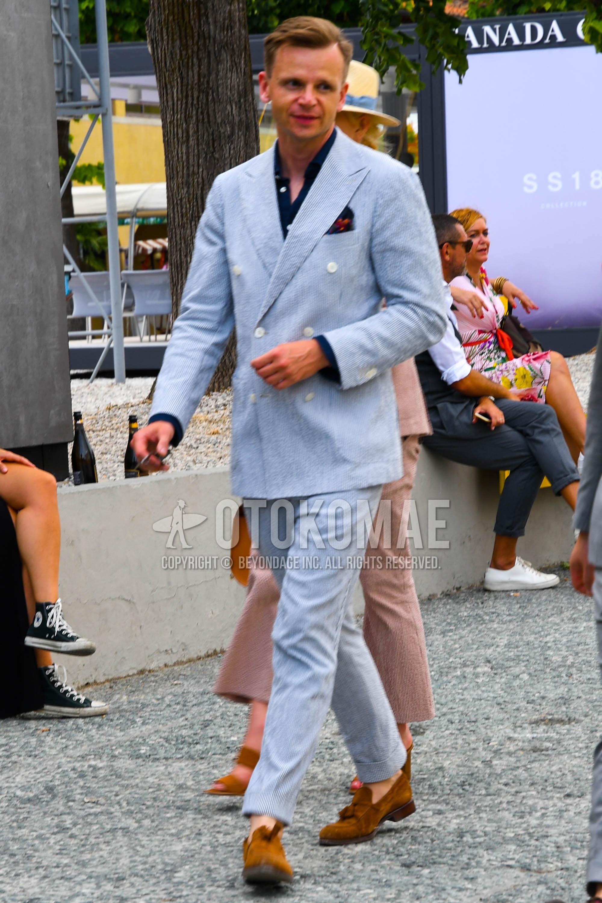 Men's spring summer autumn outfit with navy plain shirt, brown tassel loafers leather shoes, light blue plain suit.