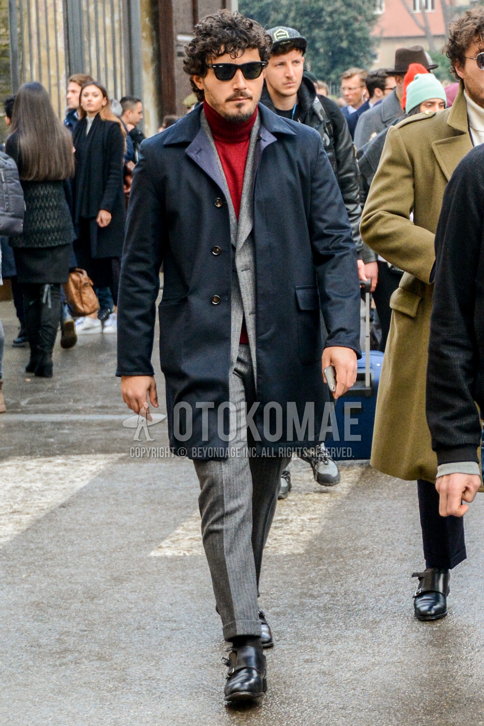Men's winter outfit with black plain sunglasses, dark gray plain stenkarrer coat, red plain turtleneck knit, black plain socks, black monk shoes leather shoes, gray plain suit.