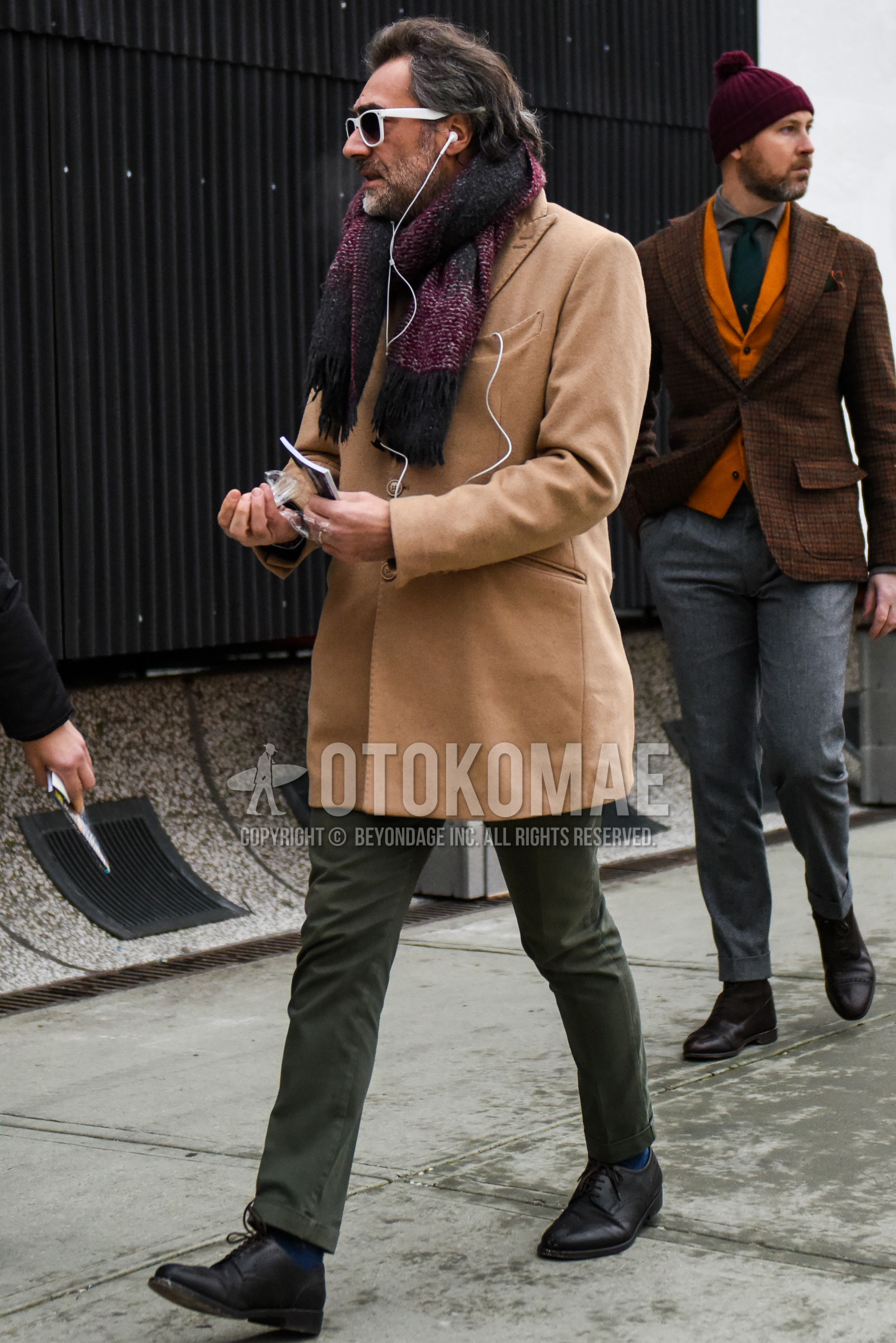 Men's autumn winter outfit with white plain sunglasses, gray red plain scarf, beige plain chester coat, plain chinos, black wing-tip shoes leather shoes.