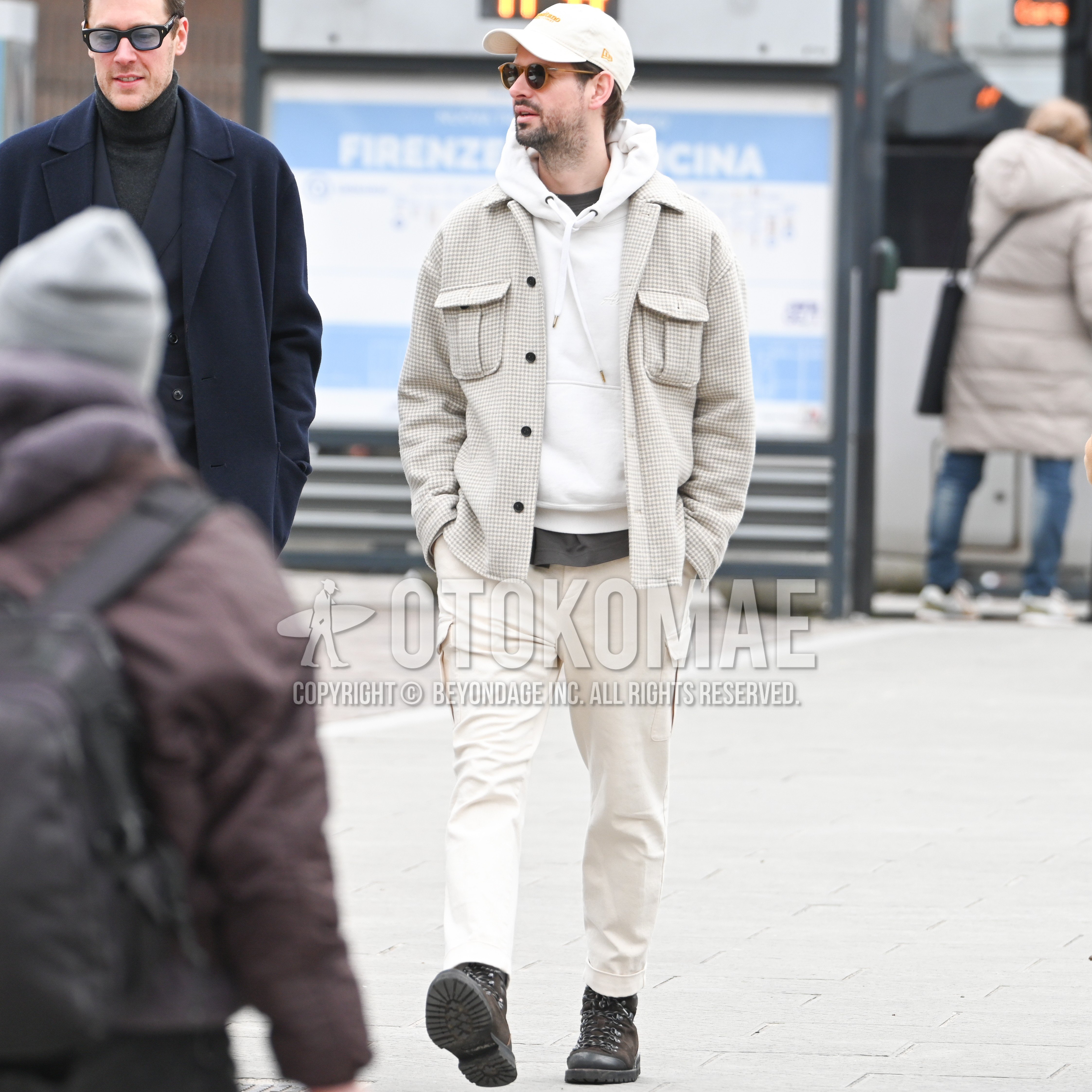 Men's spring autumn outfit with white plain baseball cap, brown plain sunglasses, gray check shirt jacket, white plain hoodie, white plain cargo pants, brown work boots.