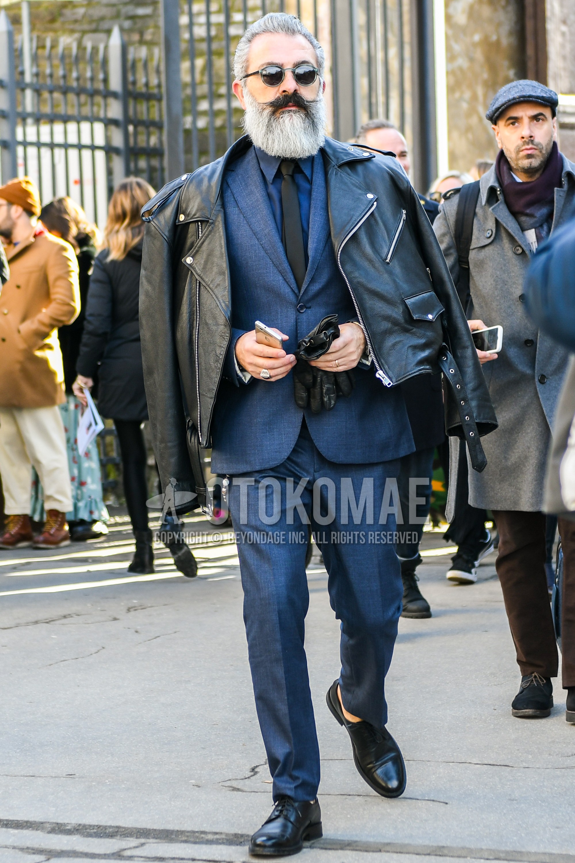 Men's spring autumn outfit with plain sunglasses, black plain riders jacket, gray plain shirt, black plain toe leather shoes, gray plain suit, gray plain necktie.
