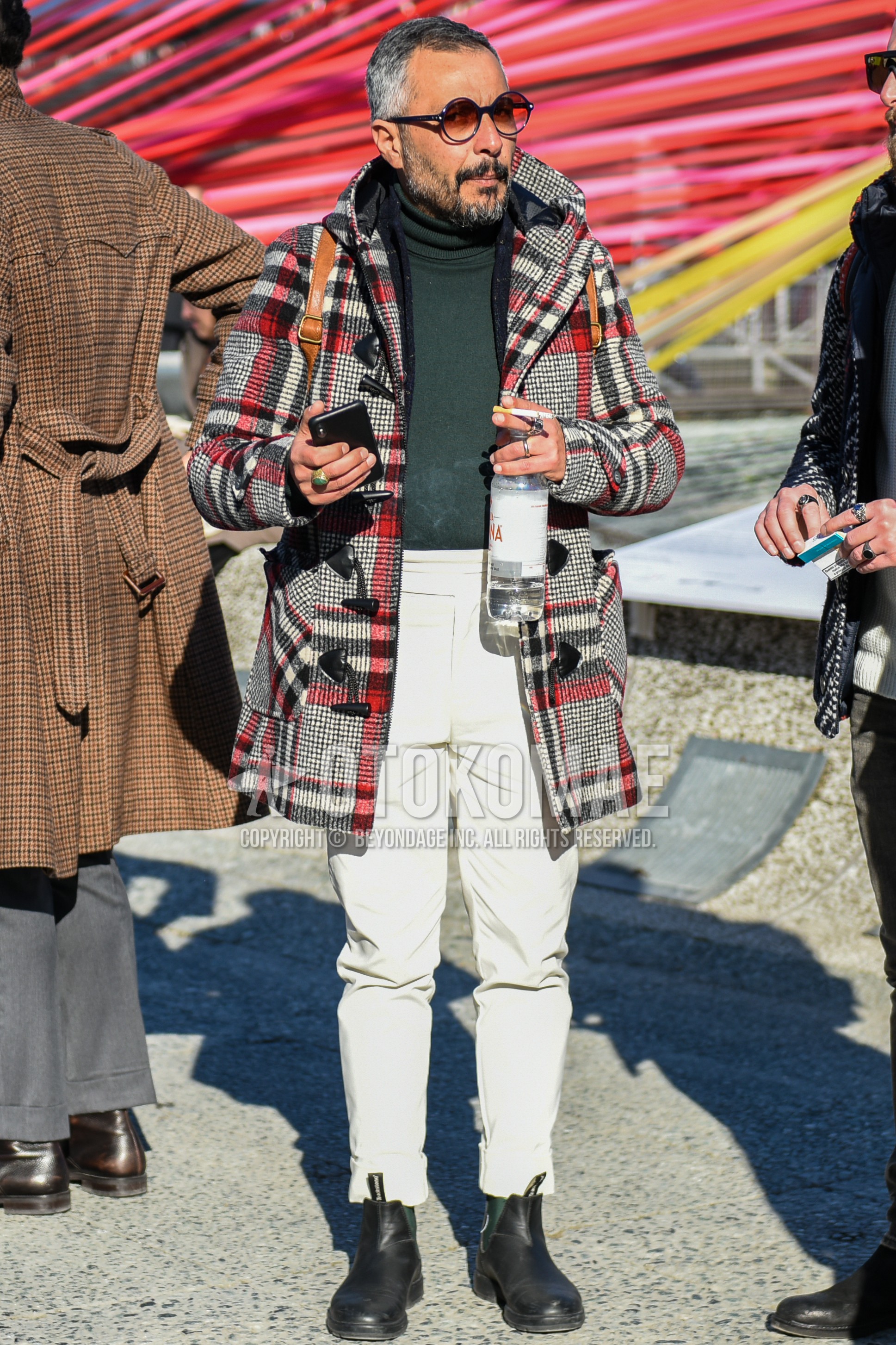 Men's autumn winter outfit with black plain sunglasses, multi-color check duffle coat, gray plain turtleneck knit, white plain winter pants (corduroy,velour), black side-gore boots.