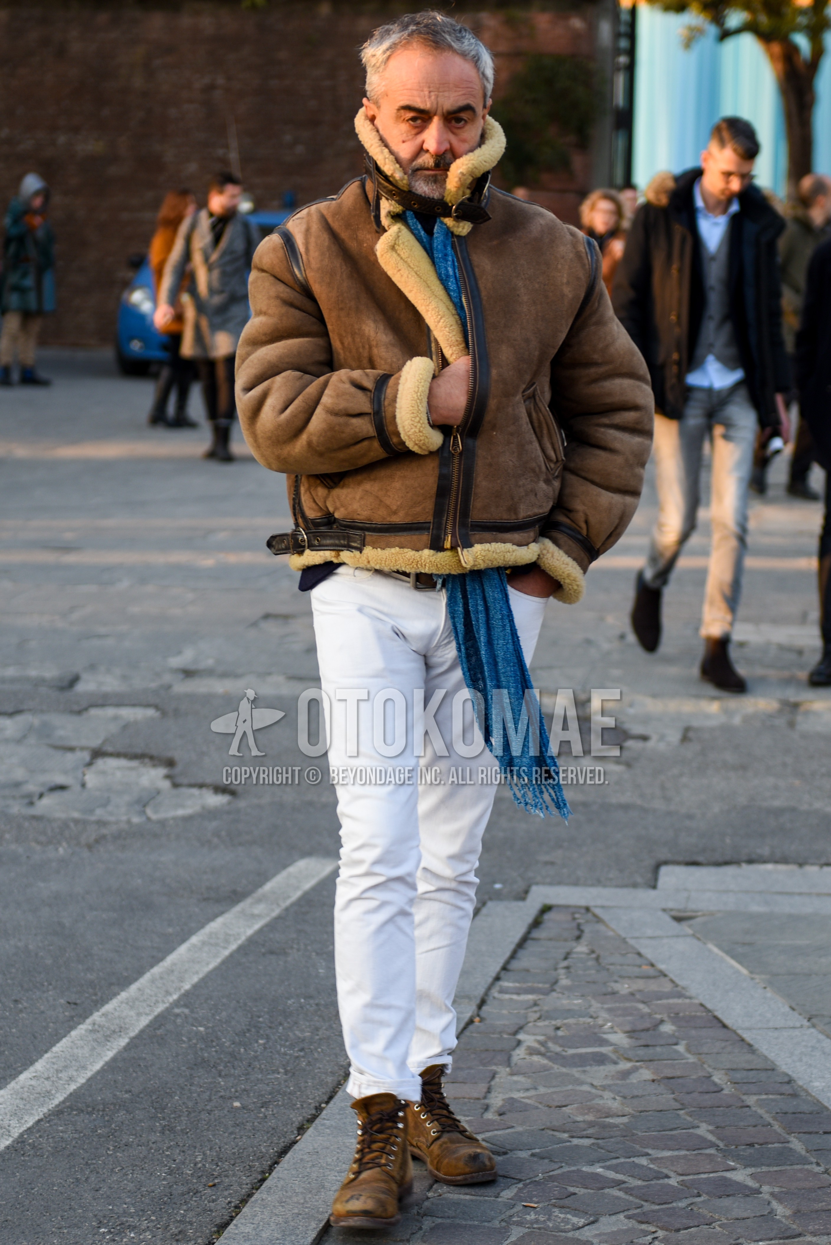 Men's autumn winter outfit with brown plain military jacket, white plain cotton pants, brown  boots.