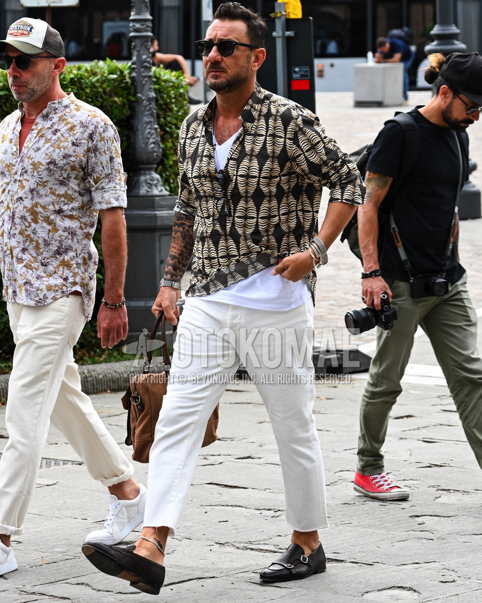 Men's spring summer autumn outfit with black plain sunglasses, black tops/innerwear shirt, white plain t-shirt, white plain chinos, brown  loafers leather shoes.