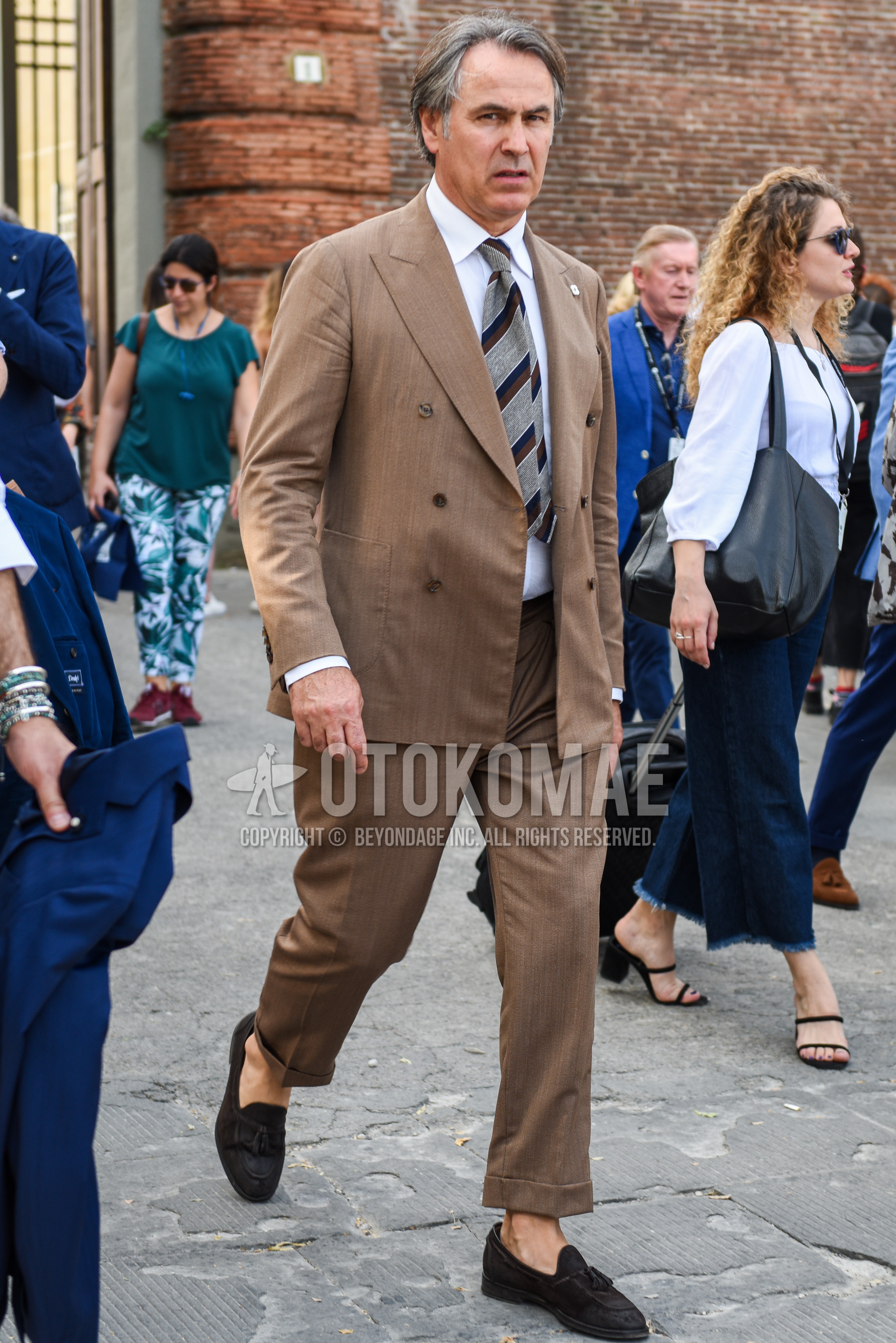 Men's spring summer autumn outfit with white plain shirt, brown tassel loafers leather shoes, brown plain suit, gray regimental necktie.