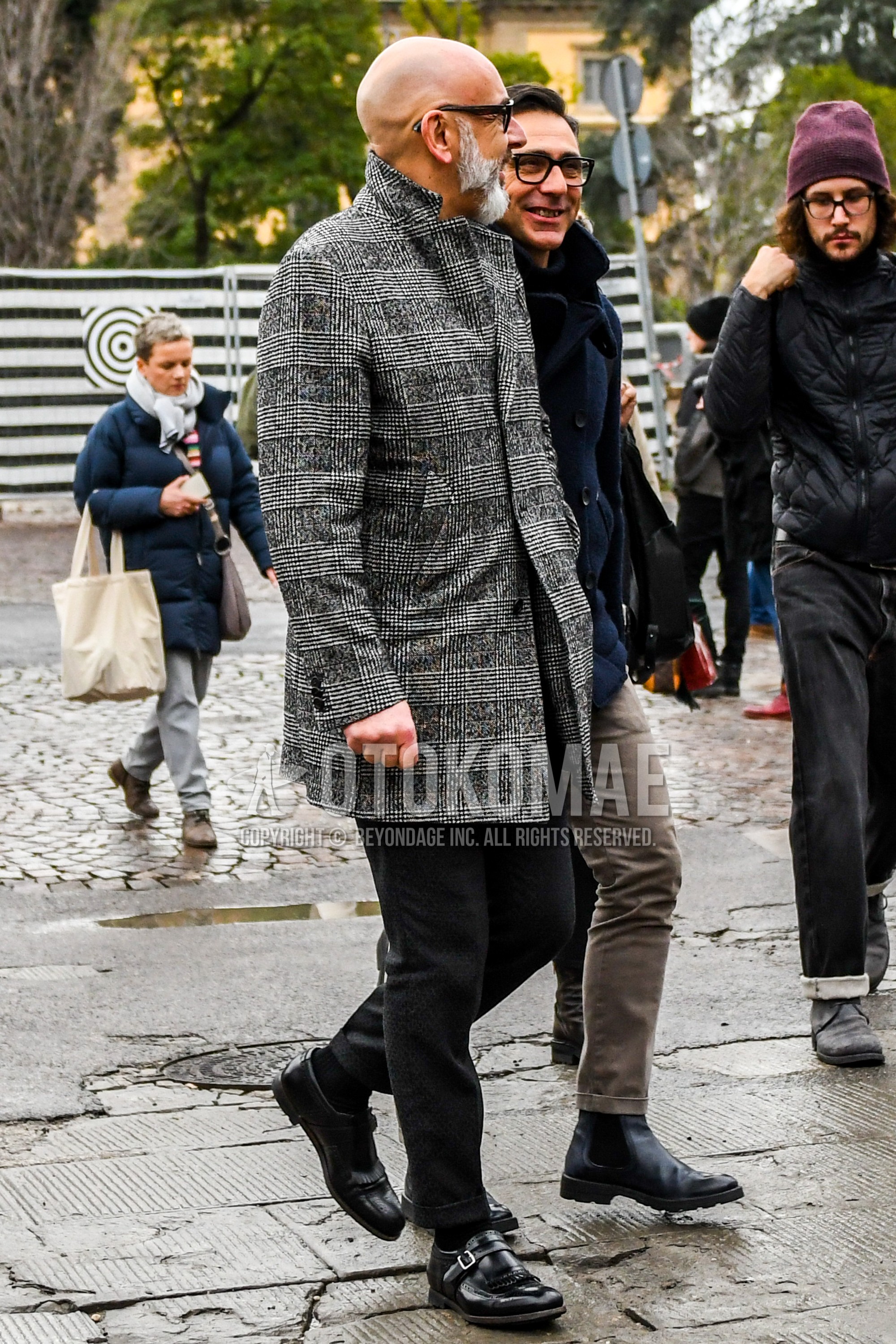 Men's winter outfit with plain sunglasses, gray check chester coat, black plain cotton pants, black plain socks, black monk shoes leather shoes.