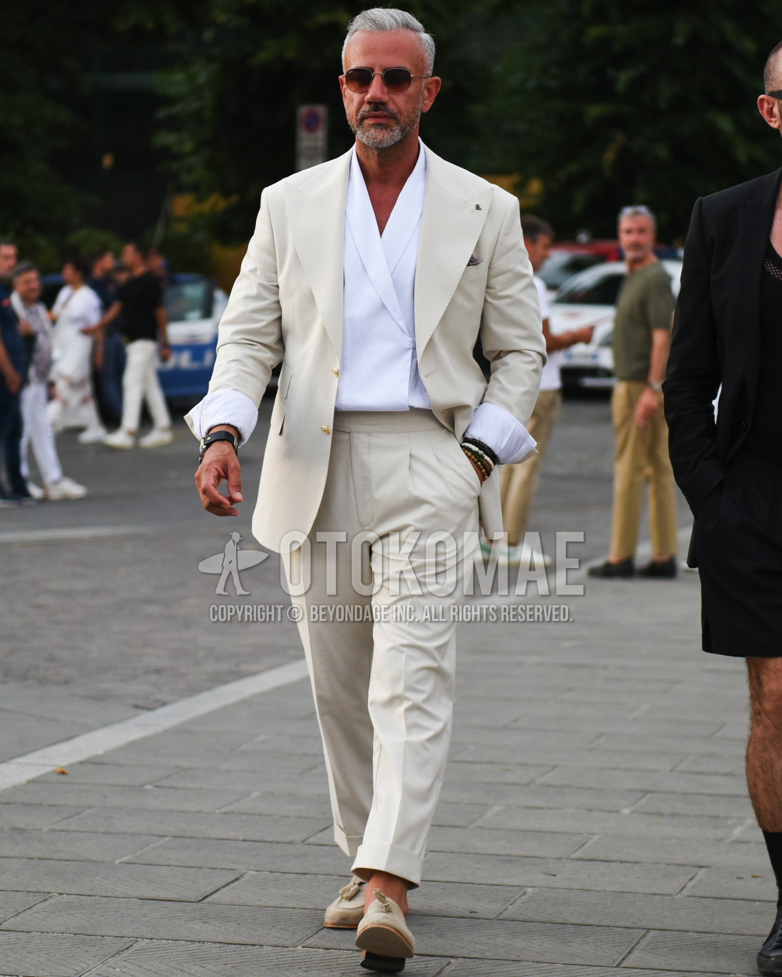Men's spring summer outfit with gold plain sunglasses, white plain shirt, beige tassel loafers leather shoes, white plain suit.