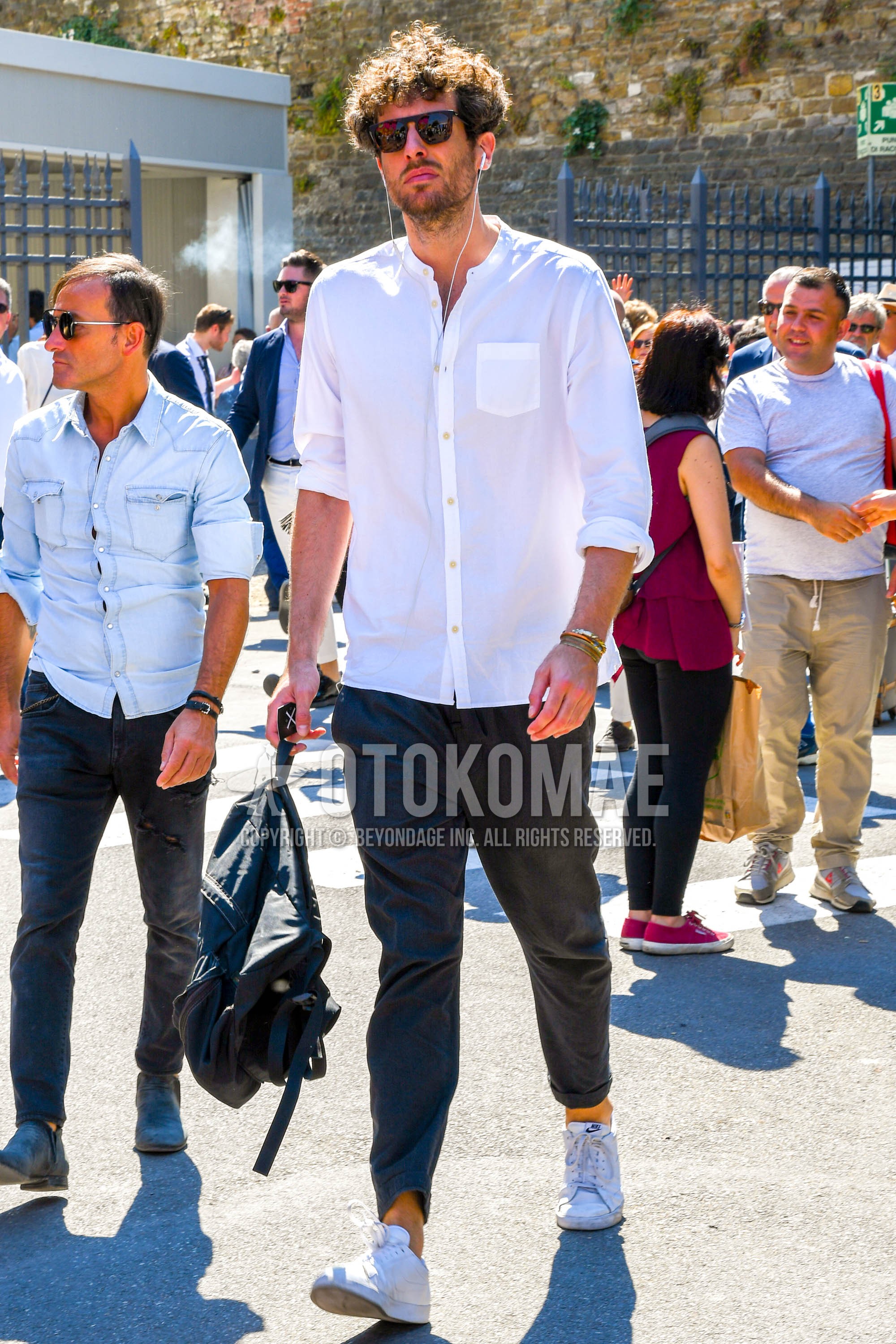 Men's spring summer outfit with plain sunglasses, white plain shirt, gray plain cotton pants, white low-cut sneakers.