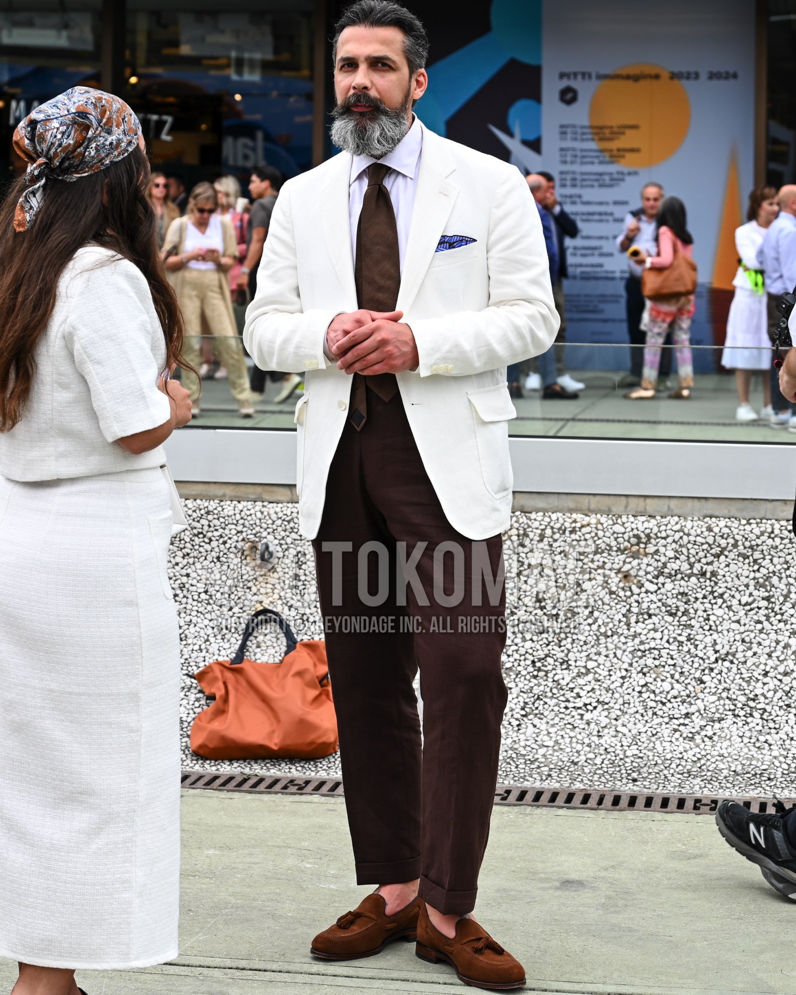 Men's spring summer autumn outfit with white plain tailored jacket, white plain shirt, brown plain slacks, brown tassel loafers leather shoes.