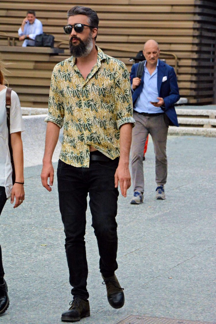 Black denim accentuates the design of the patterned shirt