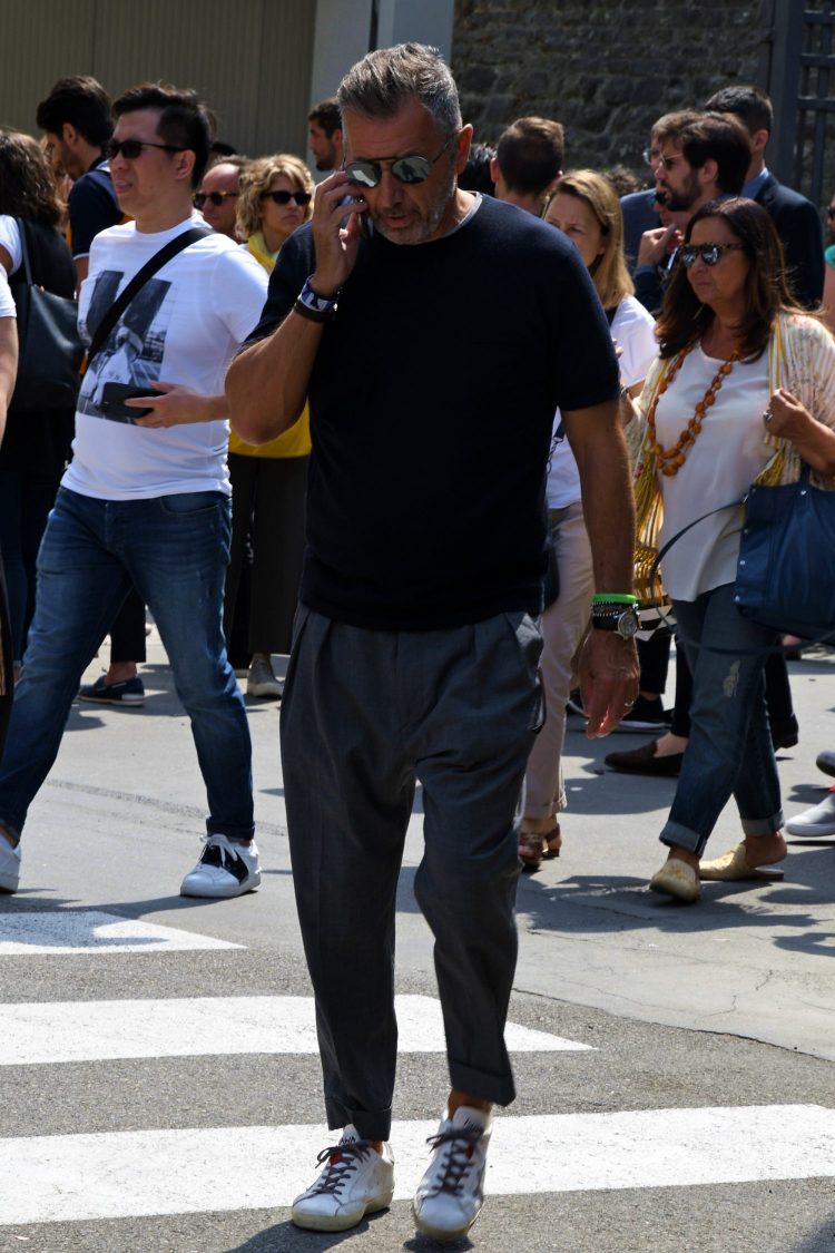 Sunglasses with mirrored lenses add subtle spice to a dark-toned coordinate.