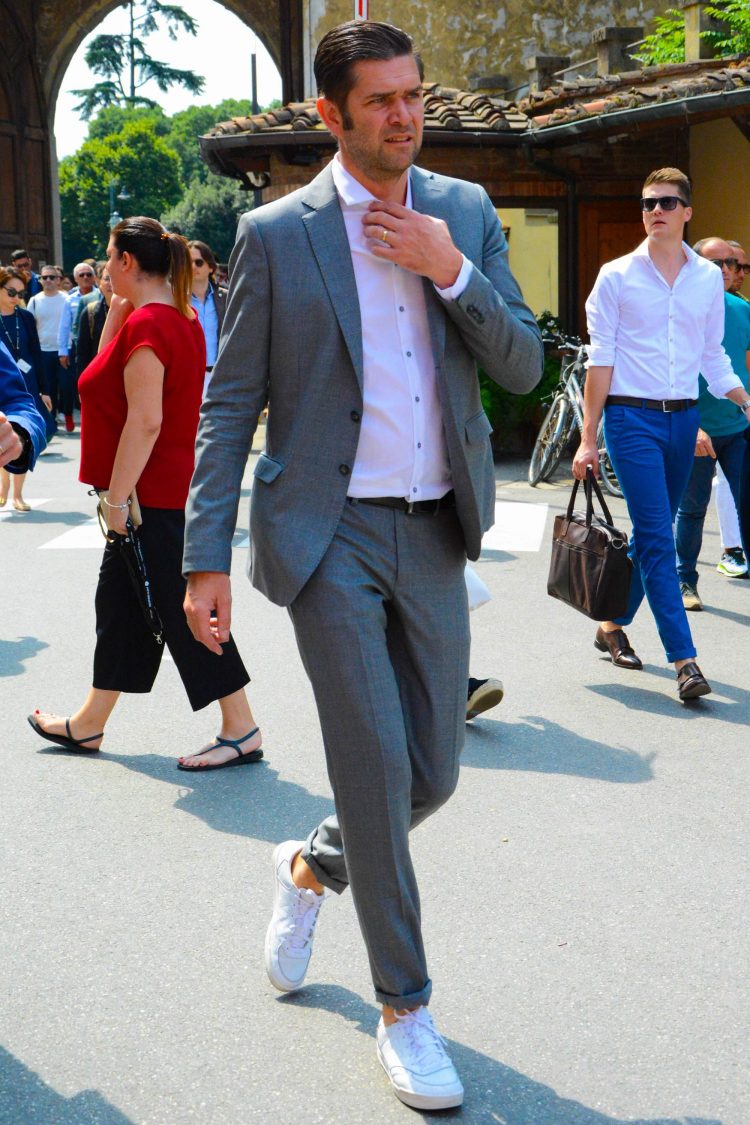 Gray suit and sneakers casual-down coordinate with achromatic colors for a unified look