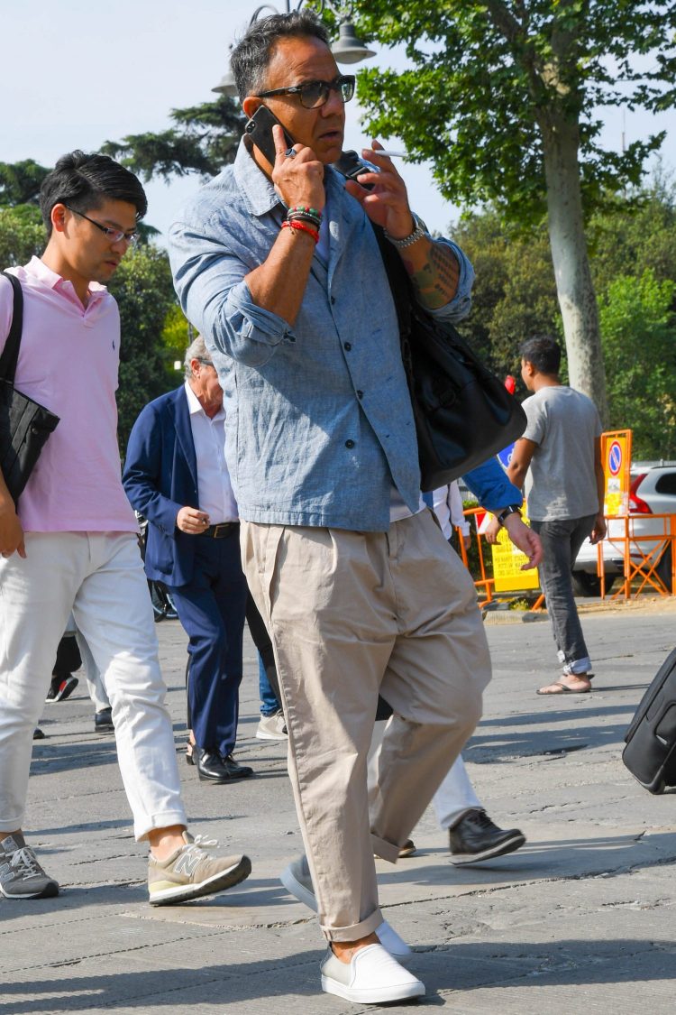 Pleated pants with a roomy waist and slip-ons for an effortless look