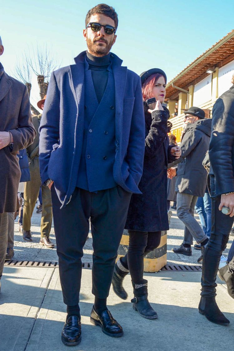 Coordinates with wool pleated pants and shiny coin loafers for a crisp material look