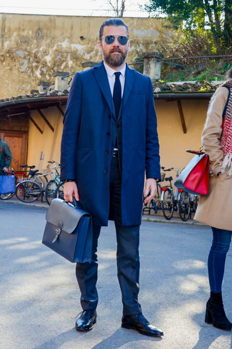Suit style with a fearless look in a built-up-shoulder chester coat