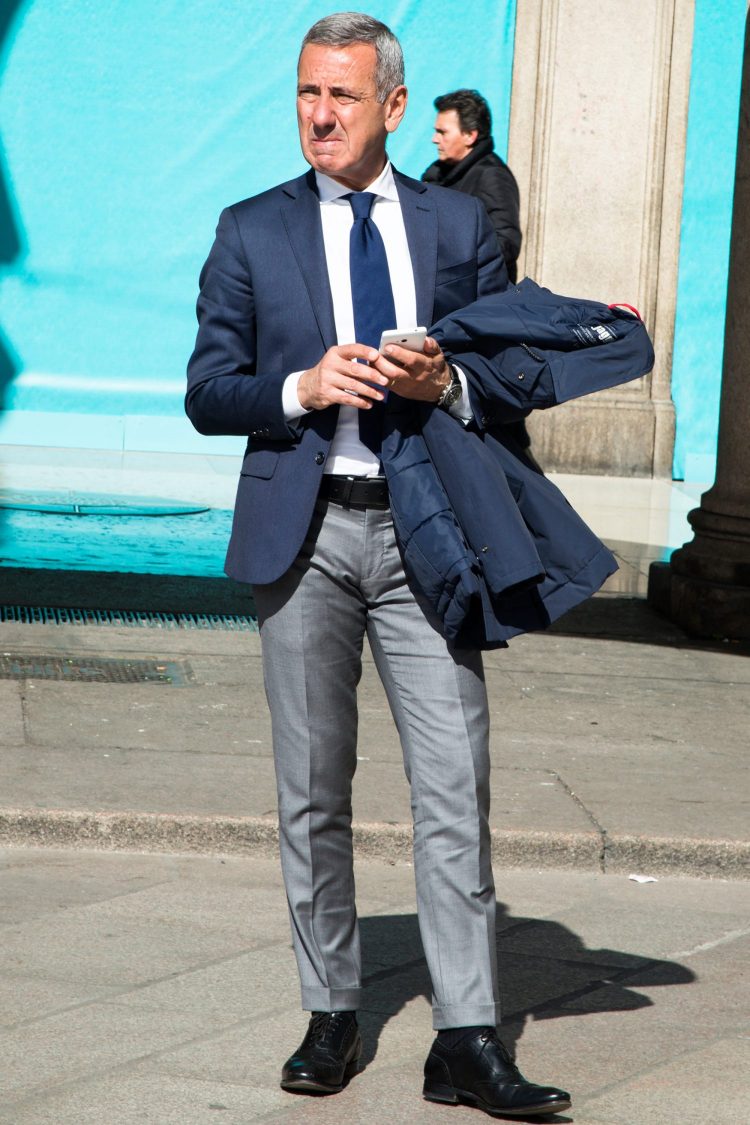 Orthodox jacket style with navy jacket and gray pants