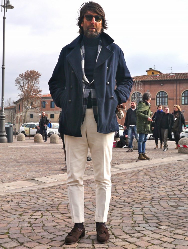 Men's coordinate that lightens up a heavy winter outfit with ankle-length white pants.