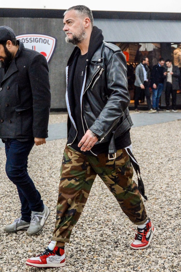 Riders jacket coordinate with street style by combining a hoodie, camo pants, and sneakers