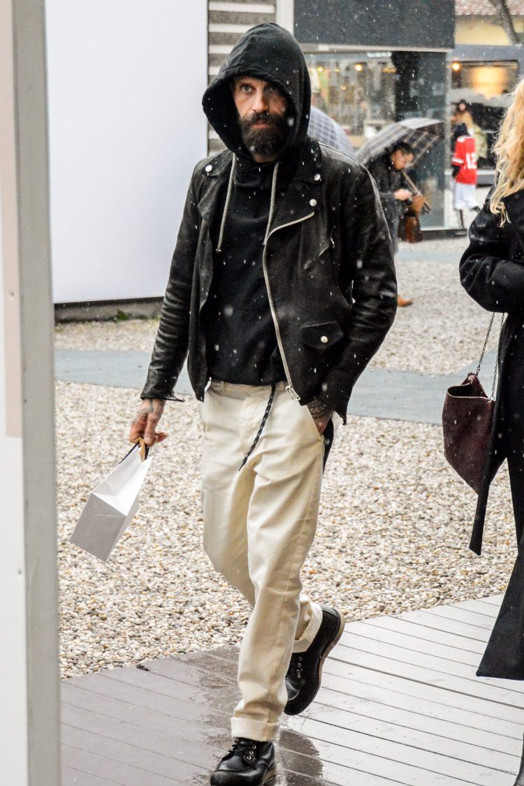 A crisp monotone coordinate with a rider's jacket and white pants