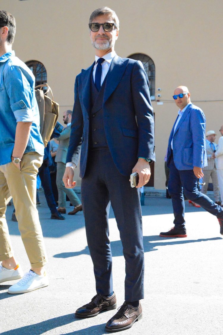 Navy suit with brown wingtips.