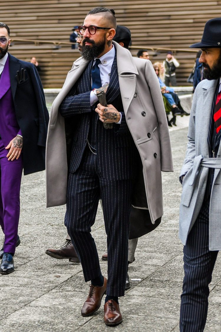 Colored pins add 3D effect and create a presence that is as strong as the navy striped suit.