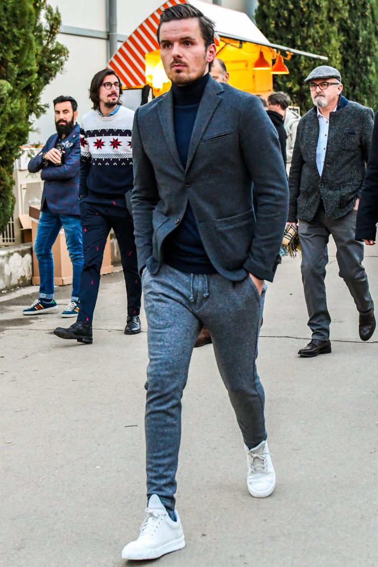 Gray pants in sweatshirt material give a sporty flavor to the jacket style.