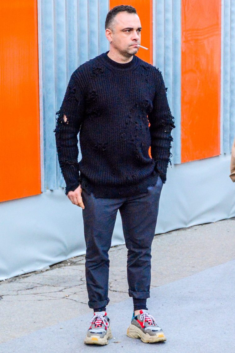 Simple gray pants complement the hot dud sneakers of the moment.