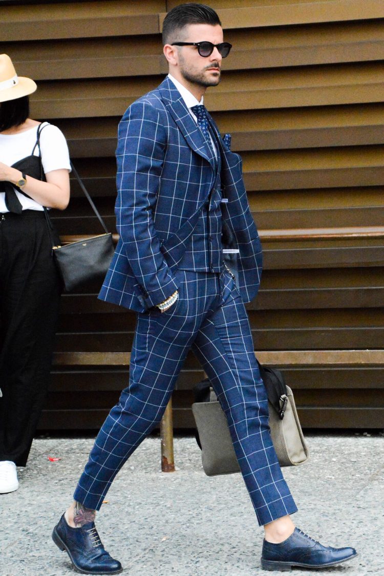 Navy wingtips are matched to create a unified suit style.