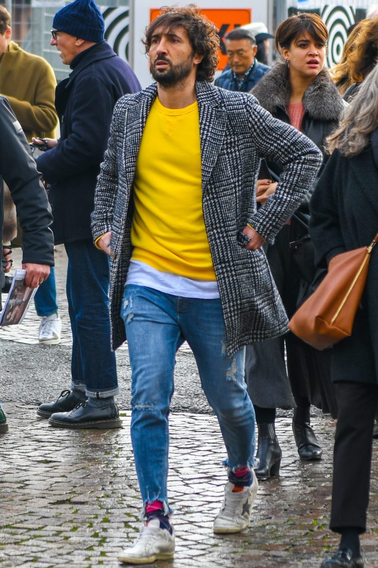 Golden Goose white sneakers and damaged jeans for a cozy footwear look