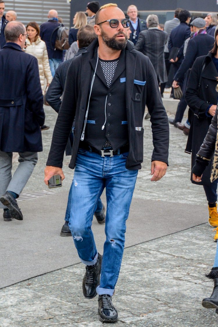 Damaged jeans and a jacket made of denim material for a unified look