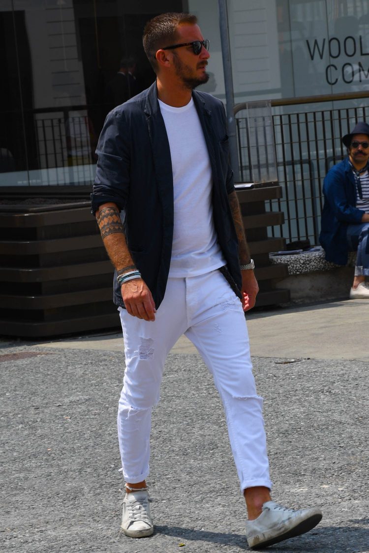 Roll-ups are used to add rhythm to white sneakers and white pants