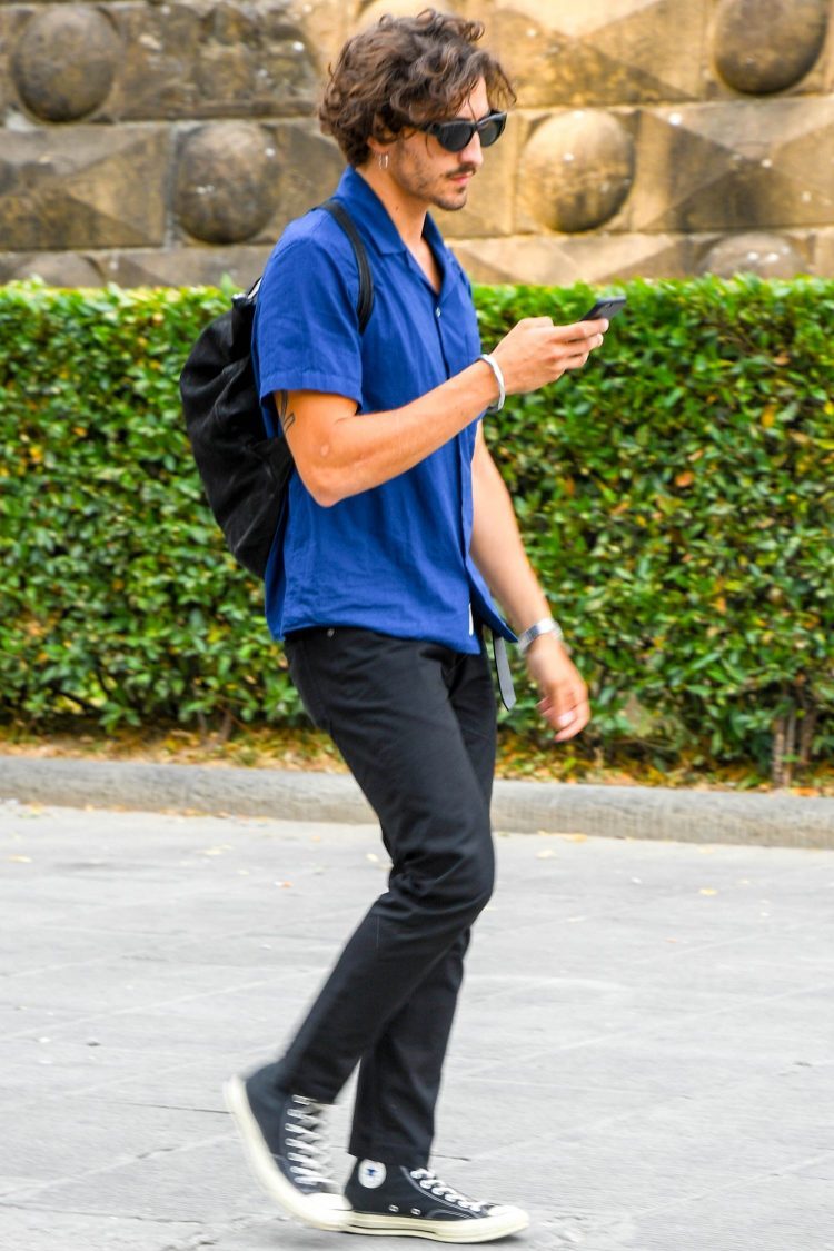 Blue shirt and black pants for a chic contrast